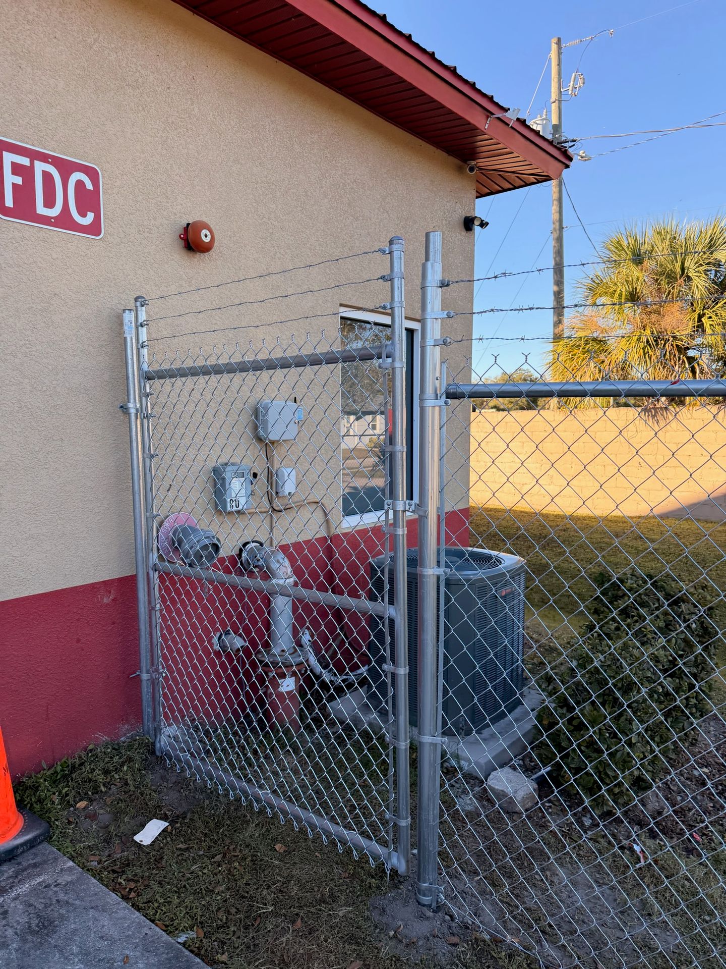 Chain-link security fence and gate installed at a Tampa commercial property in 2026