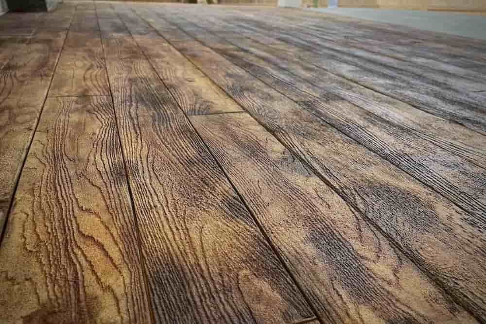 two tone acid stain concrete on a wood plank stamp on a polymer concrete overlay two tone acid stain concrete on a wood plank stamp on a polymer concrete overlay
