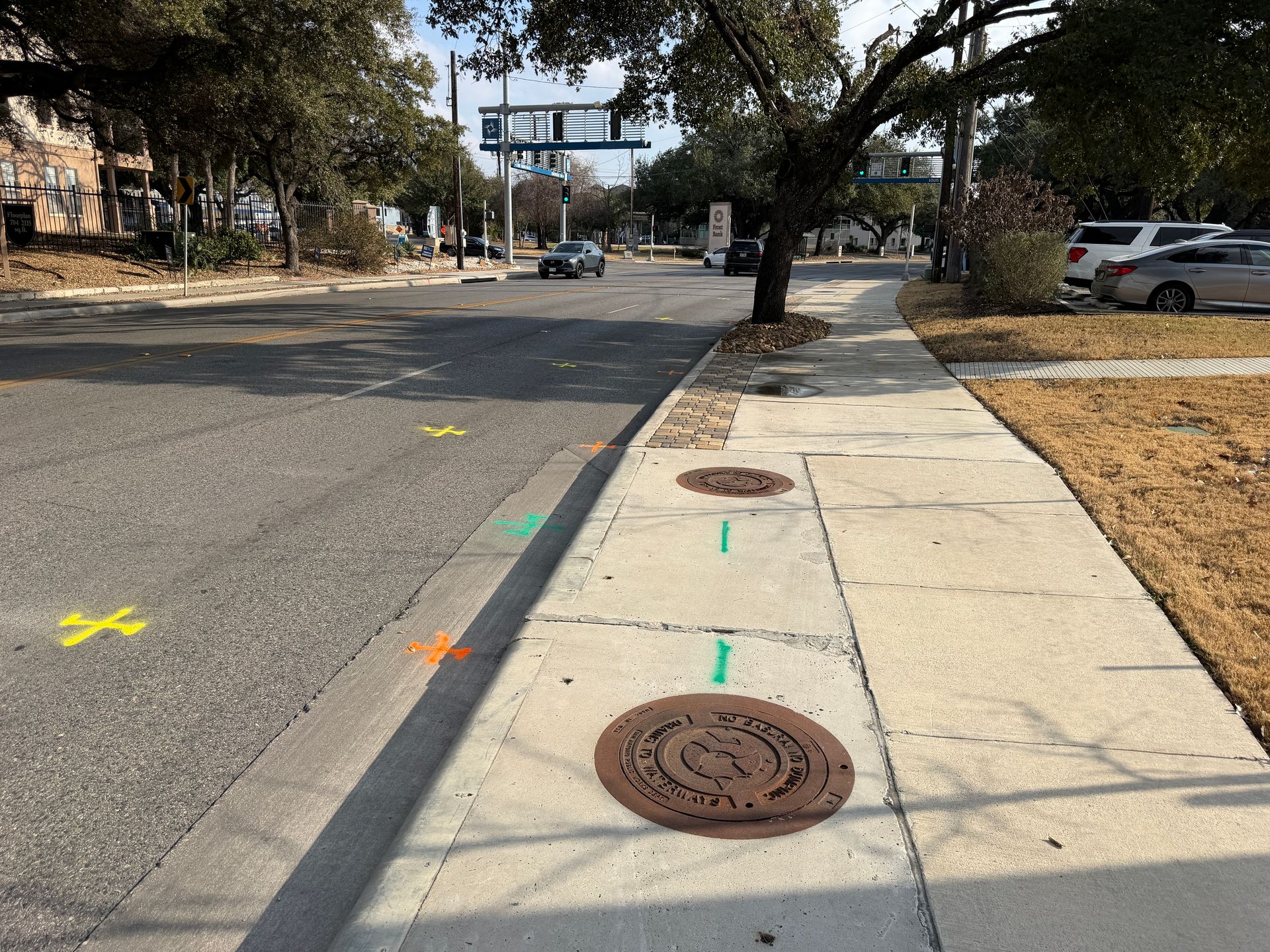 Utility locating at a commercial redevelopment site in San Antonio, TX with marked underground utilities