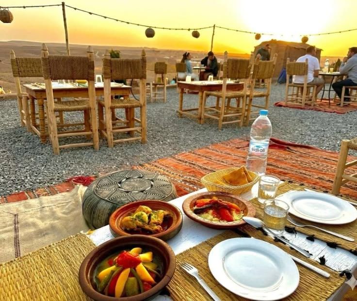 Dinner at sunset in agafay Rocky desert near Marrakech Dinner at sunset in agafay Rocky desert near Marrakech