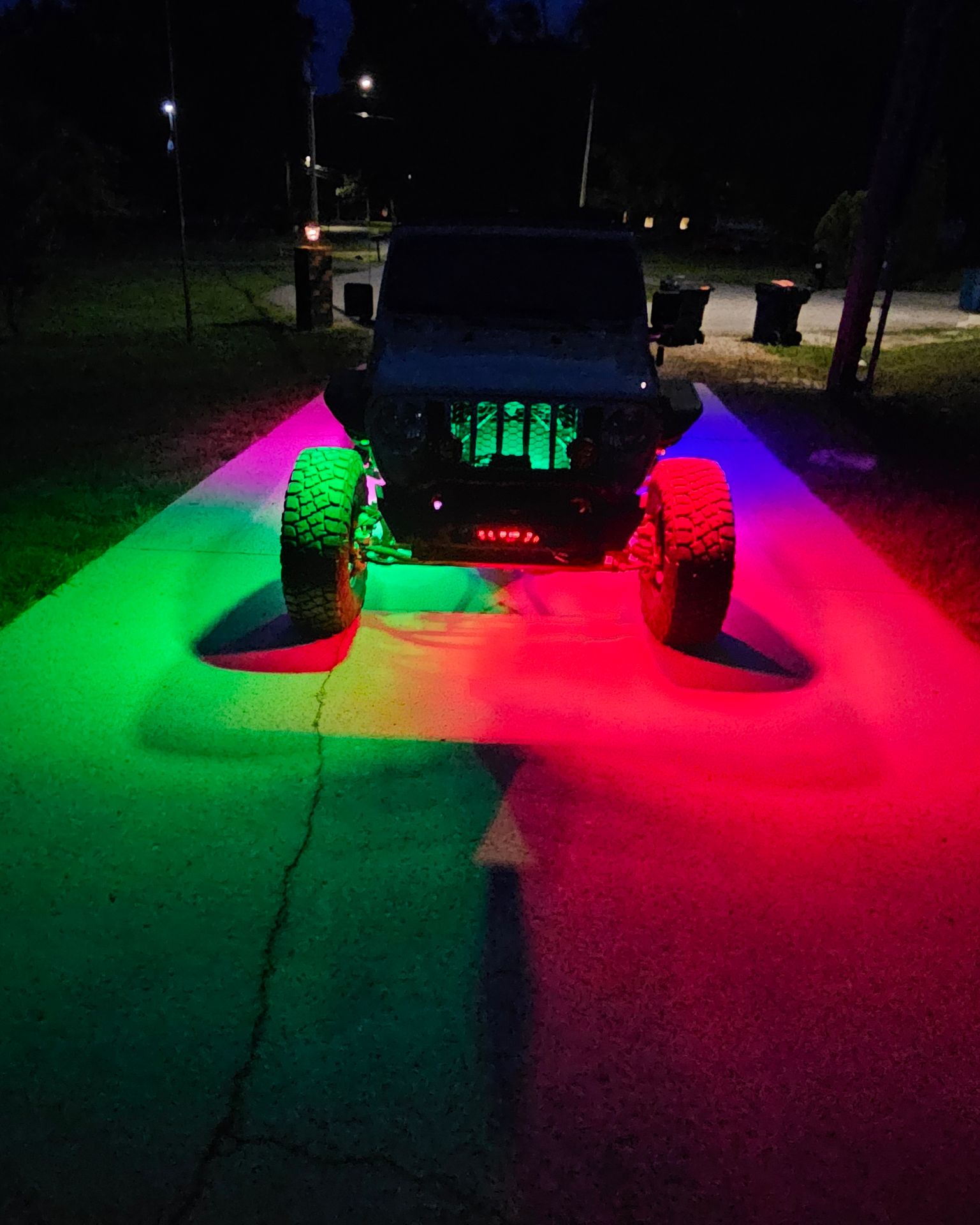 Blue Infinite Offroad rock lights under Jeep Gladiator
