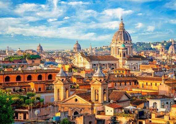 Panoramic view of Rome’s historic domes and rooftops.