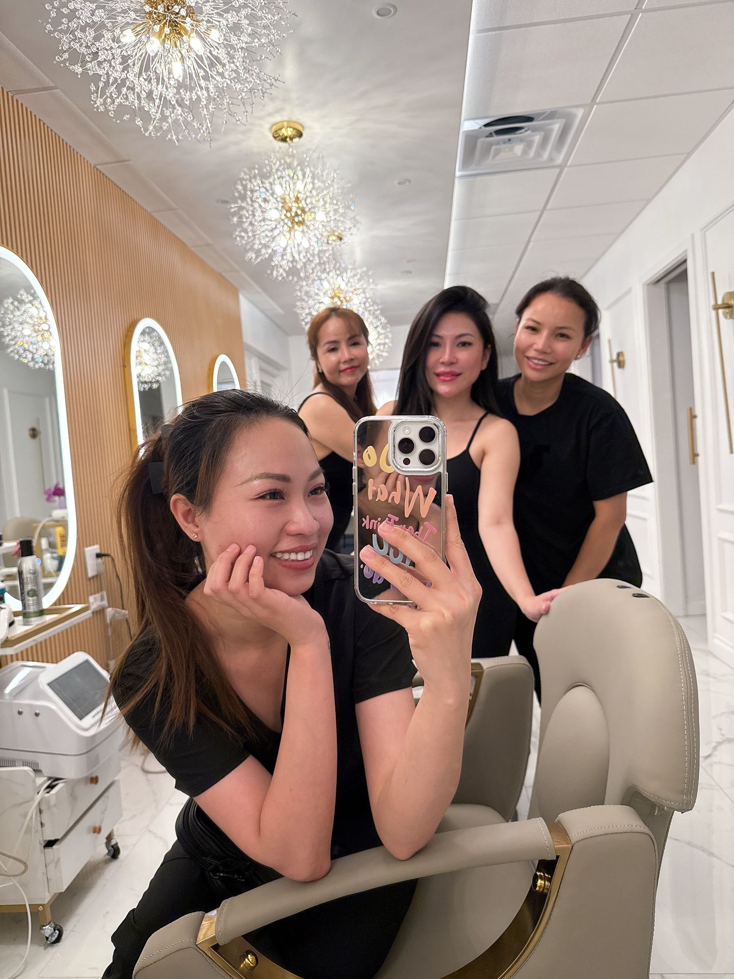 wellness therapists smiling after a group head spa appointment wellness therapists smiling after a group head spa appointment