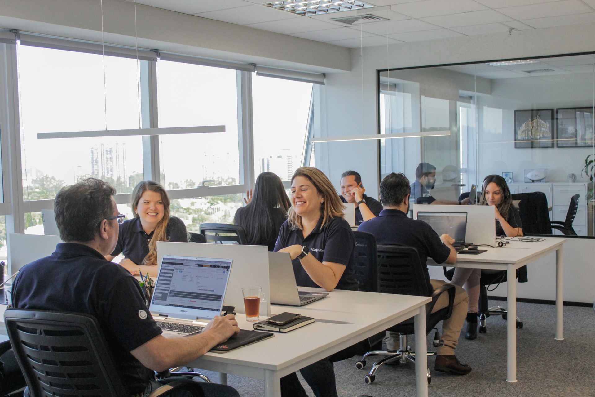 Group pf people working together with a smile in an office environment