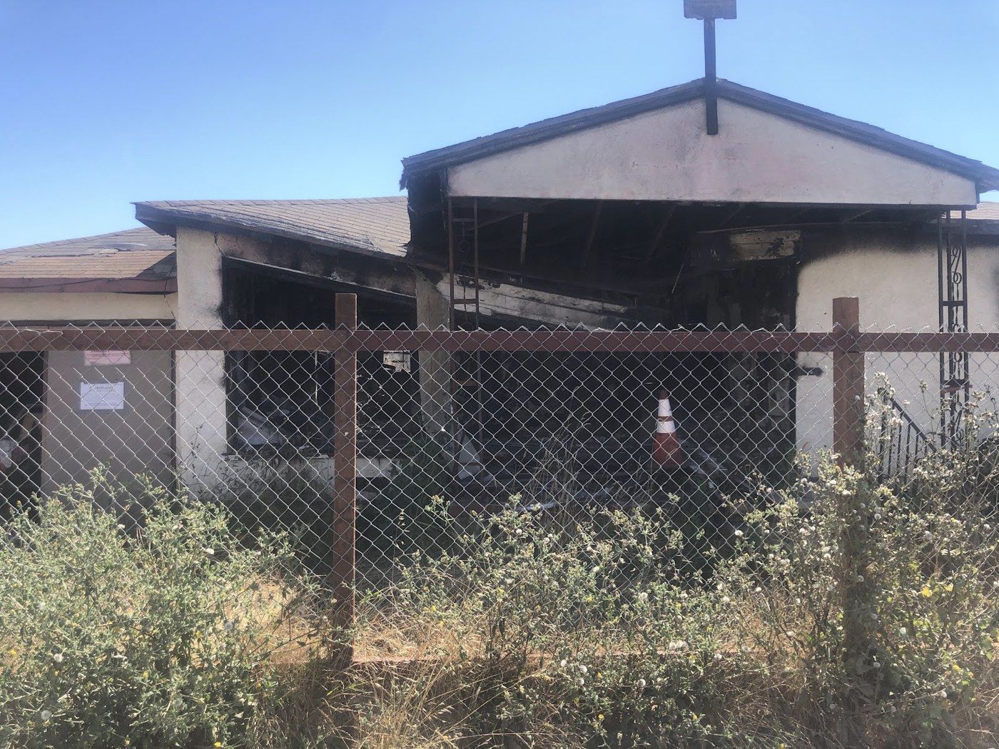 Richmond project, photo 01: Fenced property and initial building condition