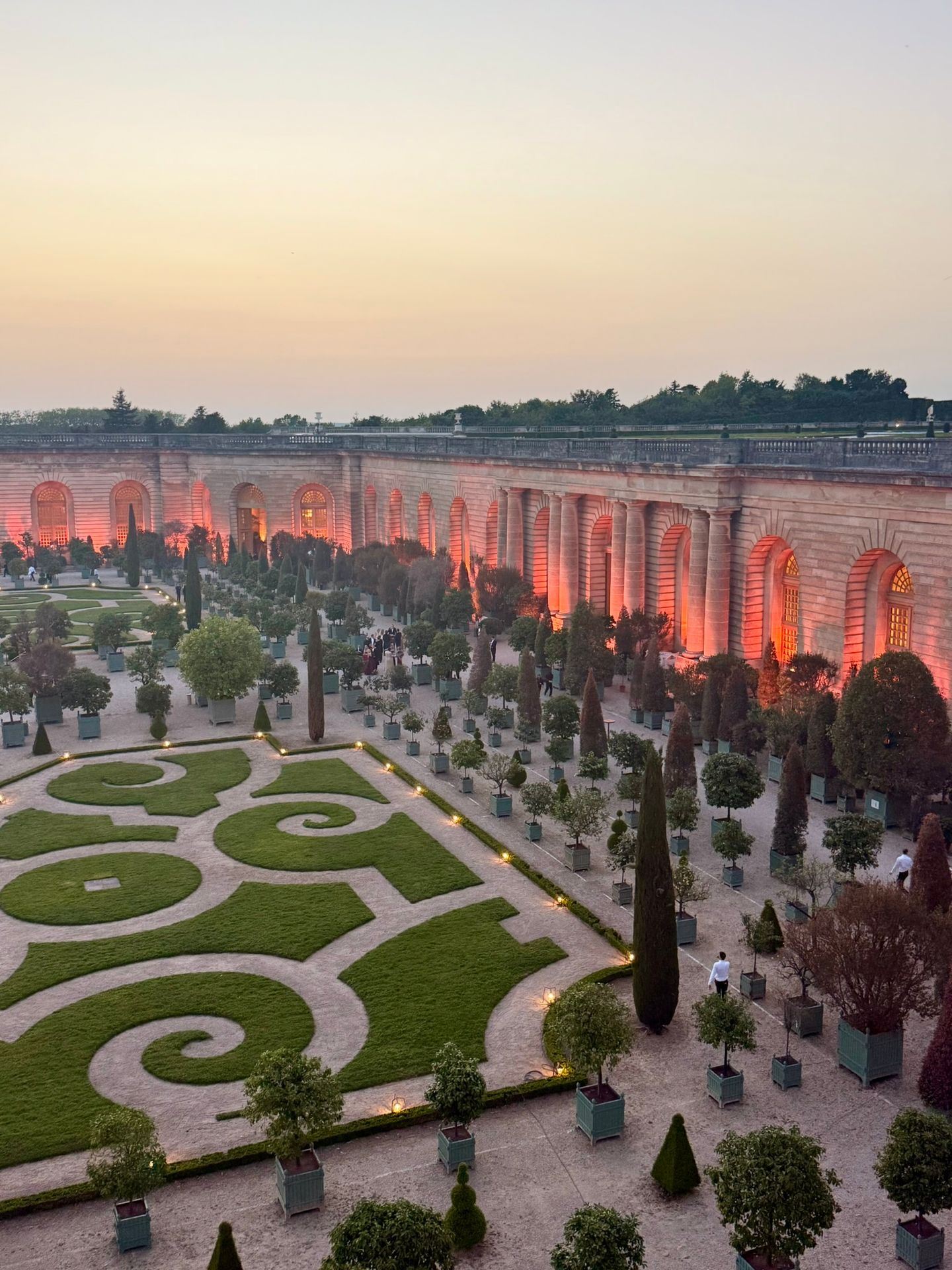 lluminated gardens of Château de Versailles during the Royal Ball event in France