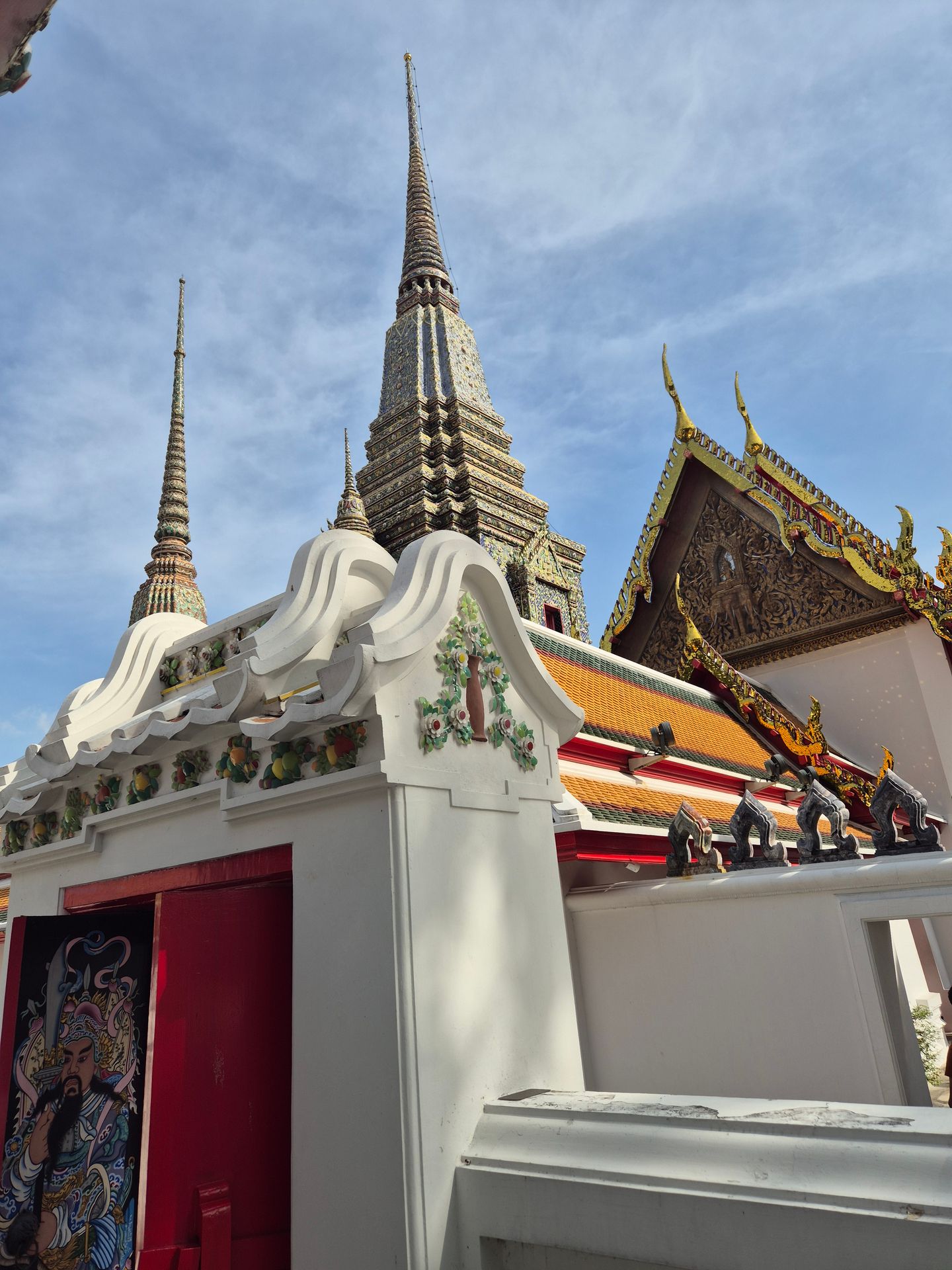 gold and red temple under blue sky