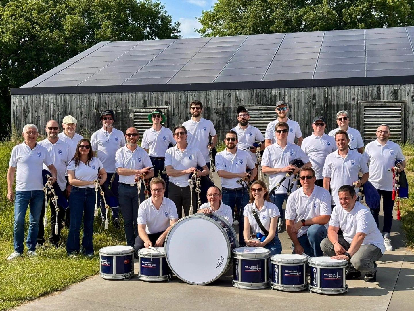 Paris and District Pipe Band group photo at the Trophée Roñsed-Mor pipe band competition in Locoal-Mendon, Brittany.
