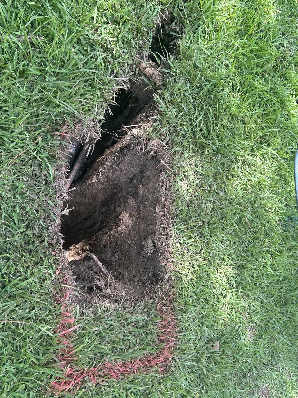 Marked pothole location on a Texas job site Marked pothole location on a Texas job site