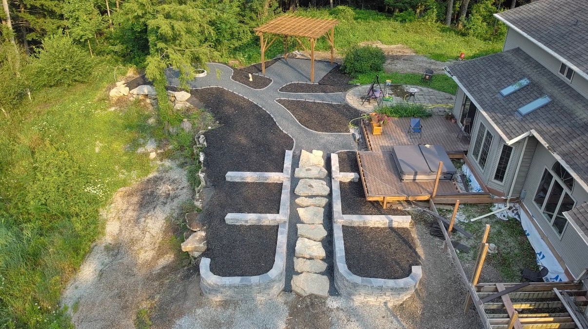 Yard & Beyond Solutions terraced retaining walls, stone steps, mulch beds and backyard paths