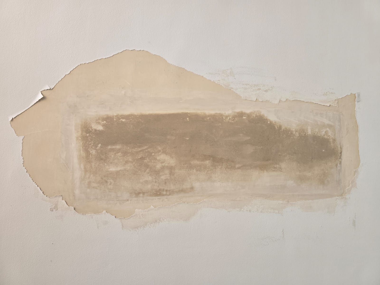 damp spot being fixed by ikapa waterproofing team