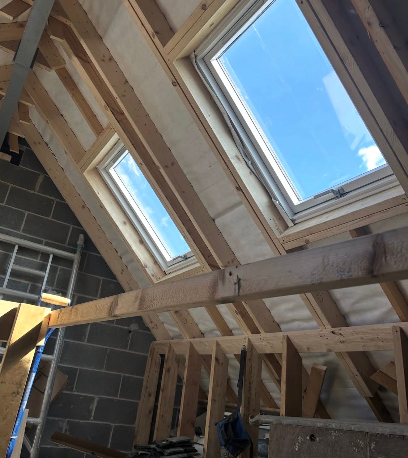Diverse contractors discussing renovation plans in spacious residential interior with new flooring, cabinetry, and natural skylighting Diverse contractors discussing renovation plans in spacious residential interior with new flooring, cabinetry, and natural skylighting