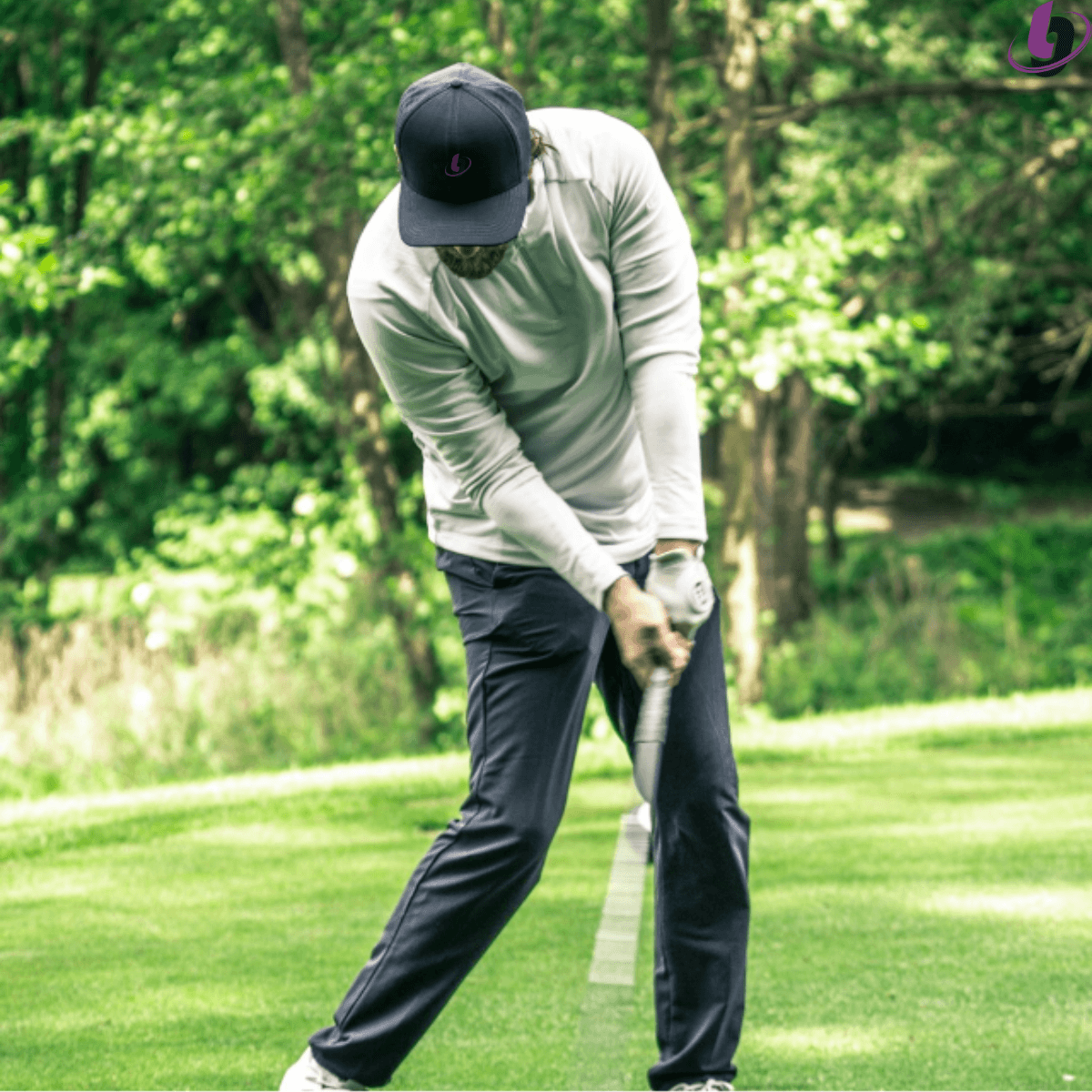 Golfer at impact demonstrating efficient energy transfer through the swing with proper sequencing and body rotation