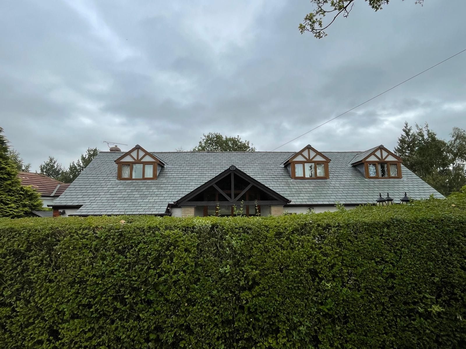 Slate roof after cleaning taken from the roadside