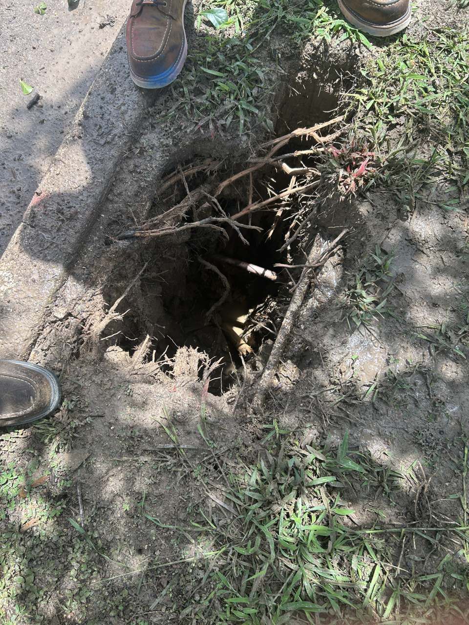 Potholing exposes a buried utility to verify depth and location before excavation