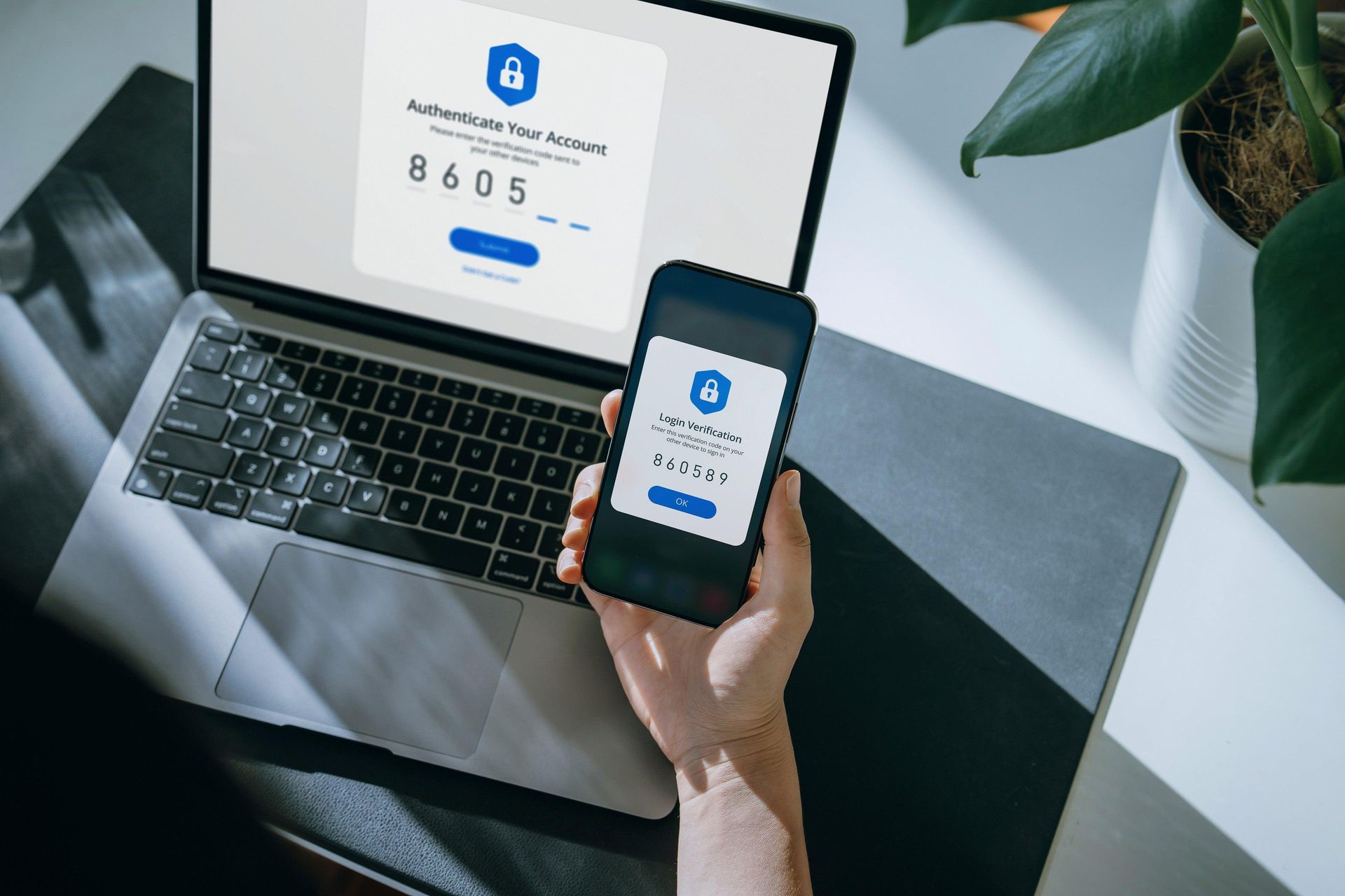 Employee using a smartphone to verify a sign-in with multifactor authentication. Employee using a smartphone to verify a sign-in with multifactor authentication.