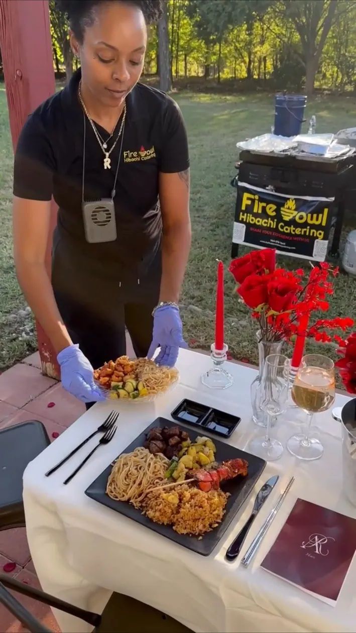 Chef serving a private hibachi dinner