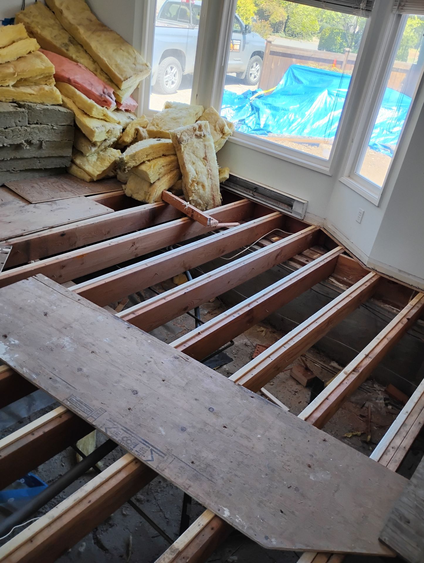 Flooring and subfloor removed to re-level the joists. Flooring and subfloor removed to re-level the joists.