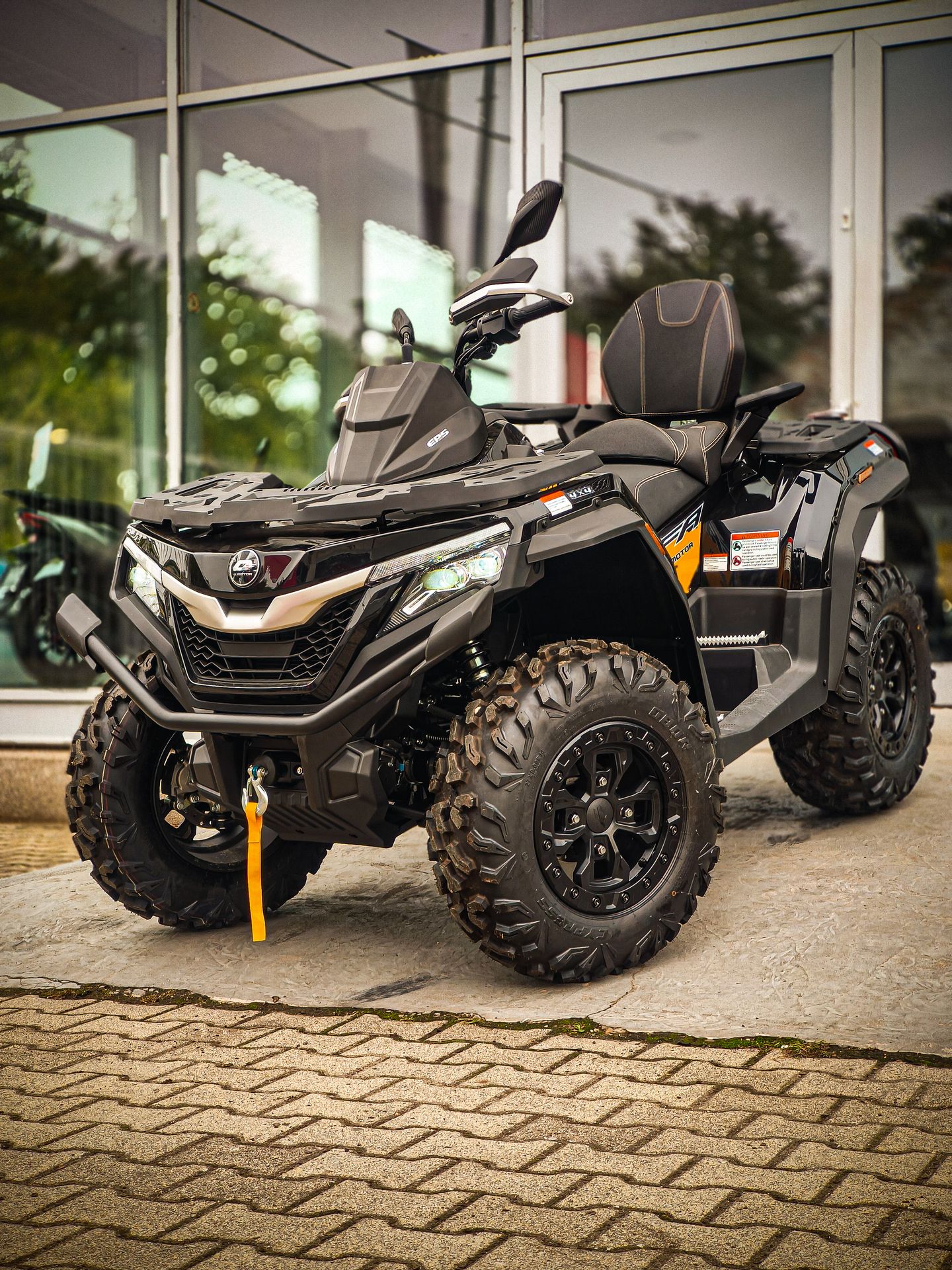 Off road vehicle parked on a dusty road, showcasing its rugged tires and suspension system ready for adventure