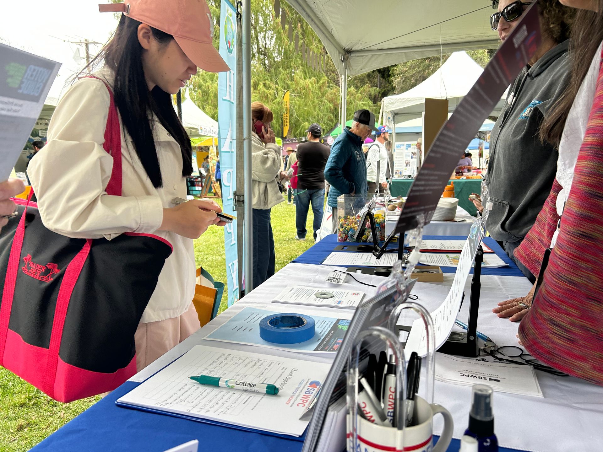 A community member visiting an SBWPC information table