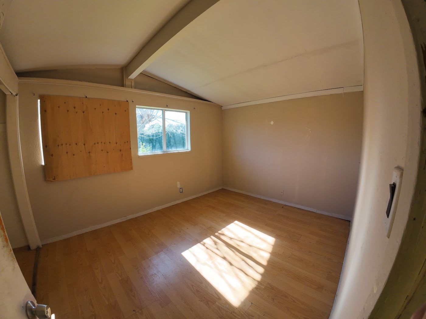 Concord project, photo 06: Boarded window and pre-renovation room