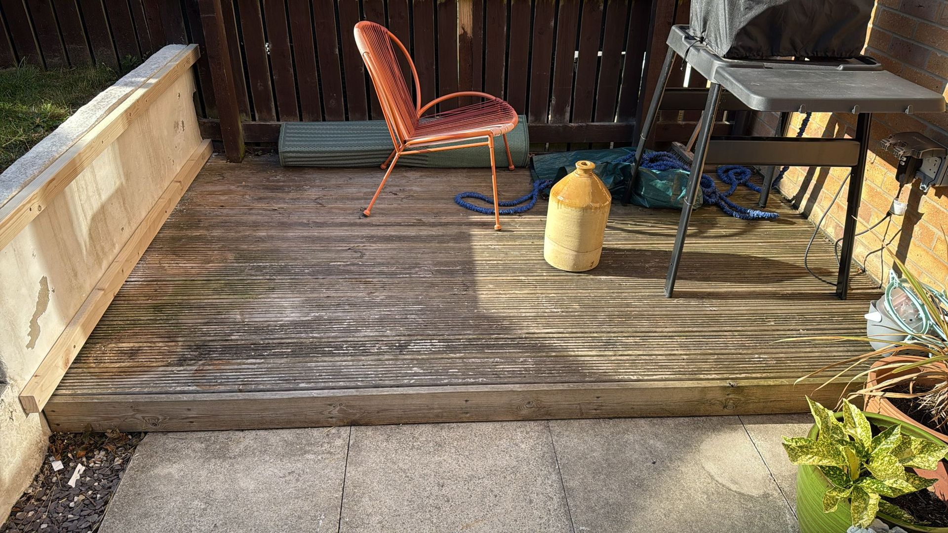 Softwood Decking before cleaning, with flaky paint and slippery surface
