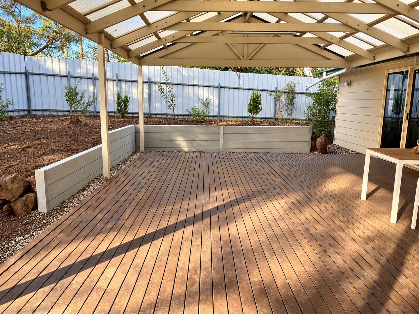 Concrete sleeper wall beside an existing deck