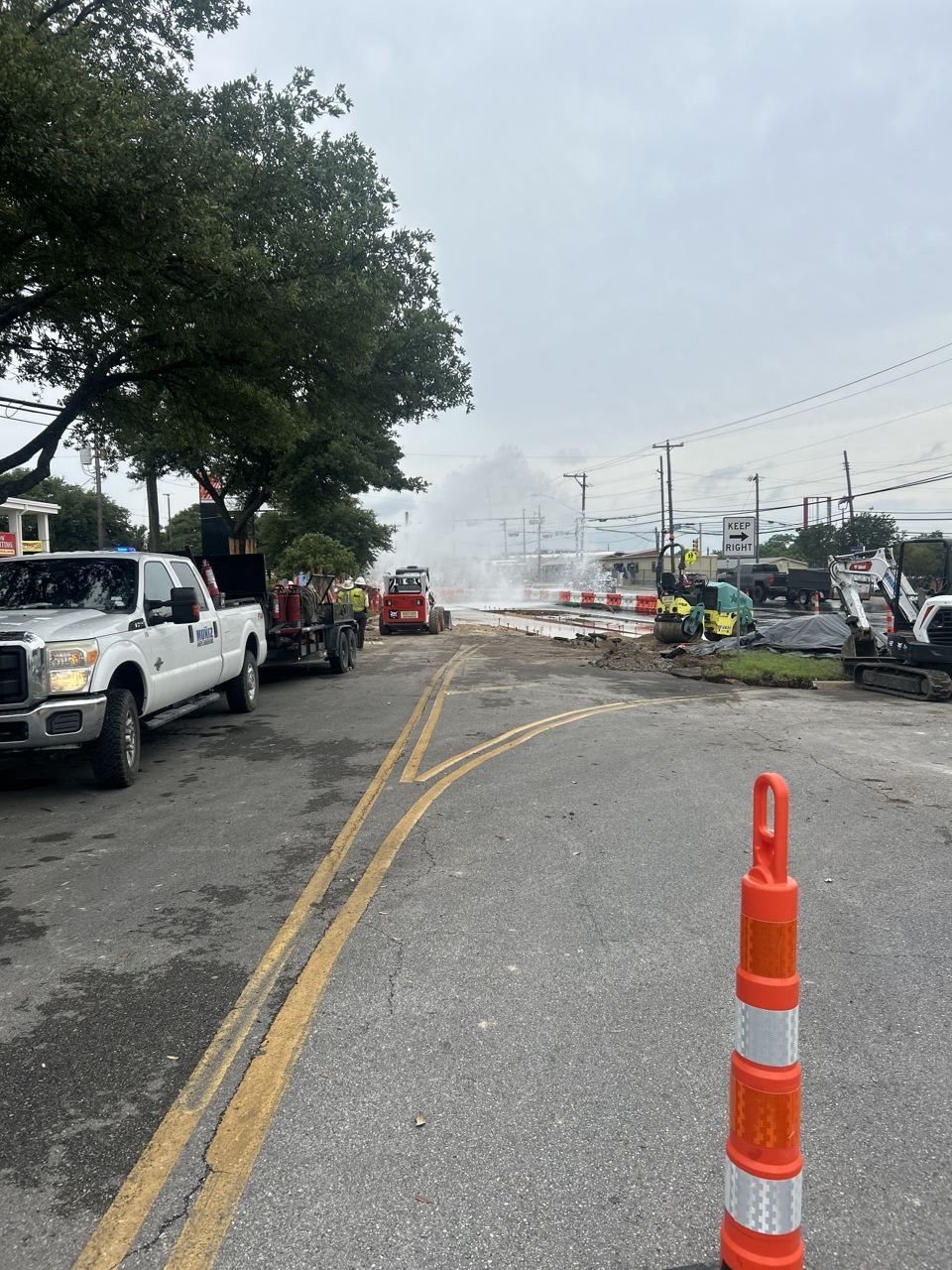 Utility crew working an emergency water main break repair in Texas Utility crew working an emergency water main break repair in Texas