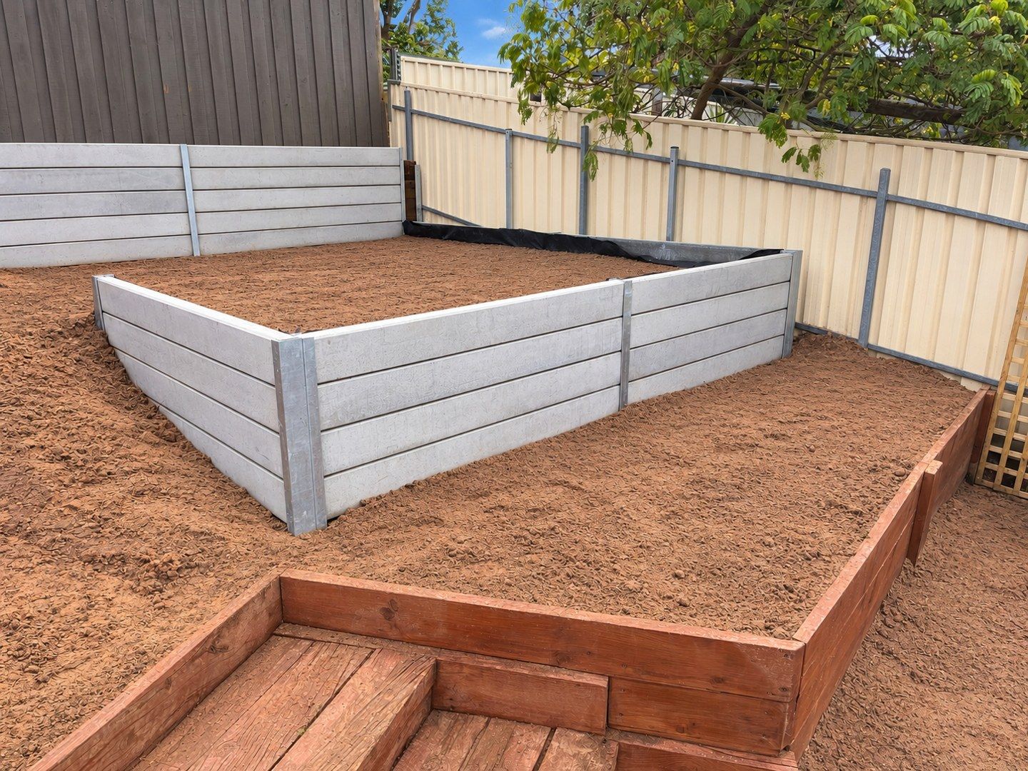 Concrete sleeper walls defining level changes
