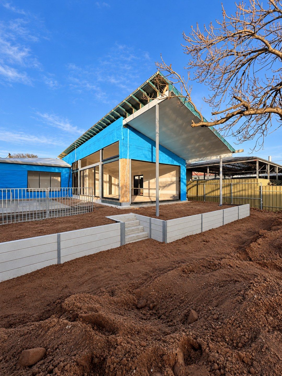 Concrete sleeper wall and steps at a new home