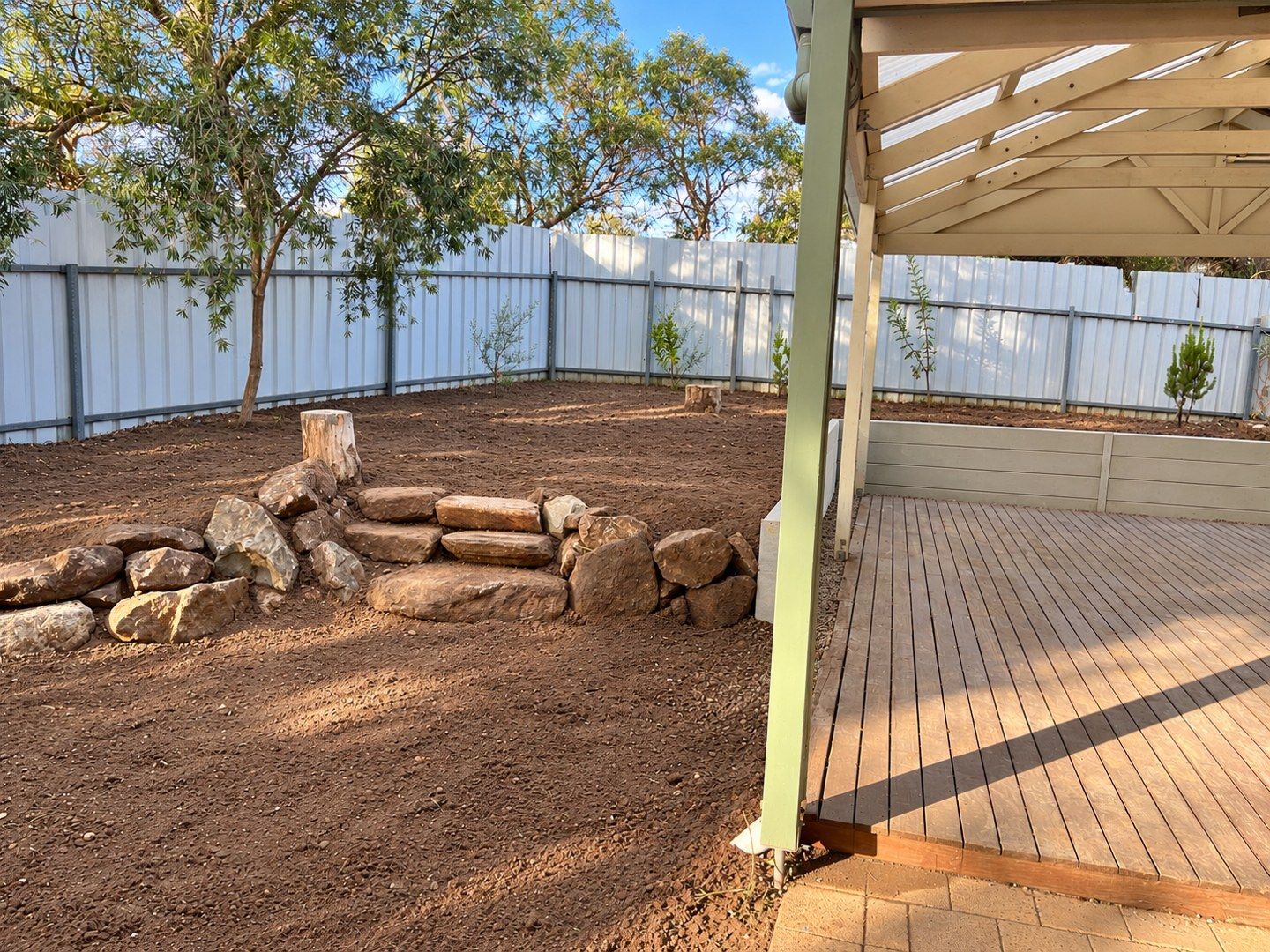 Concrete sleepers beside existing steps and deck