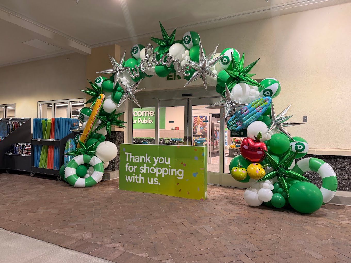 Publix Grand Opening Fernandina Beach Balloon Arch featuring custom beach balls, inflatable pub sub, starburst foil balloons Publix Grand Opening Fernandina Beach Balloon Arch featuring custom beach balls, inflatable pub sub, starburst foil balloons