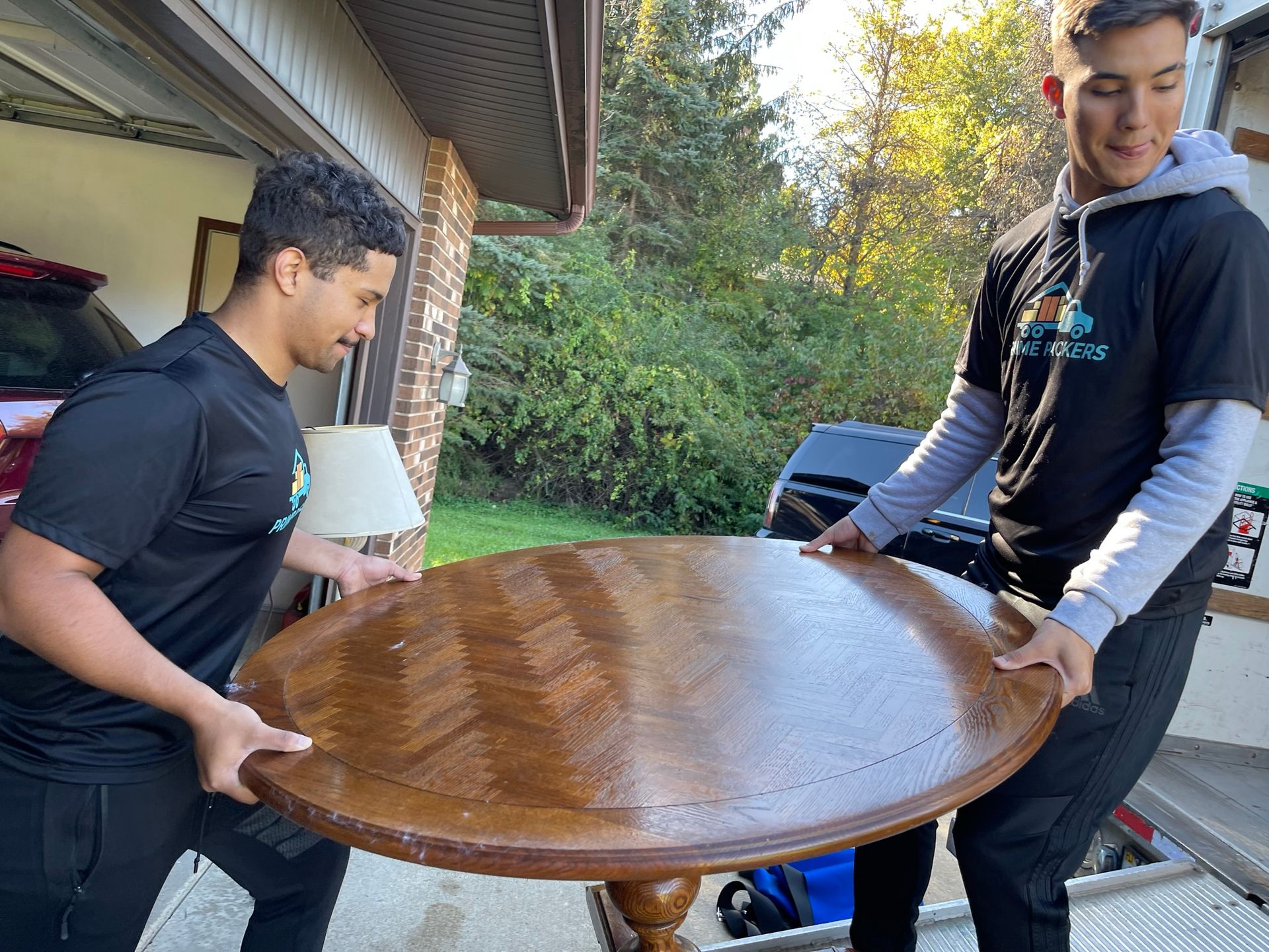 Prime Packers LLC moving crew loading furniture for a residential move in Portage, Michigan