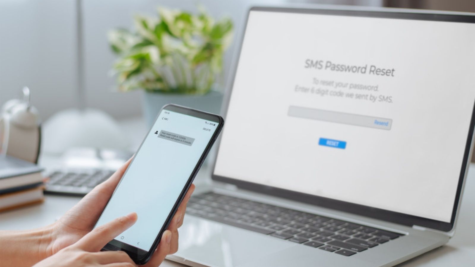 Phone showing a fake text message beside a laptop, What Actually Happens When You Report a Scam