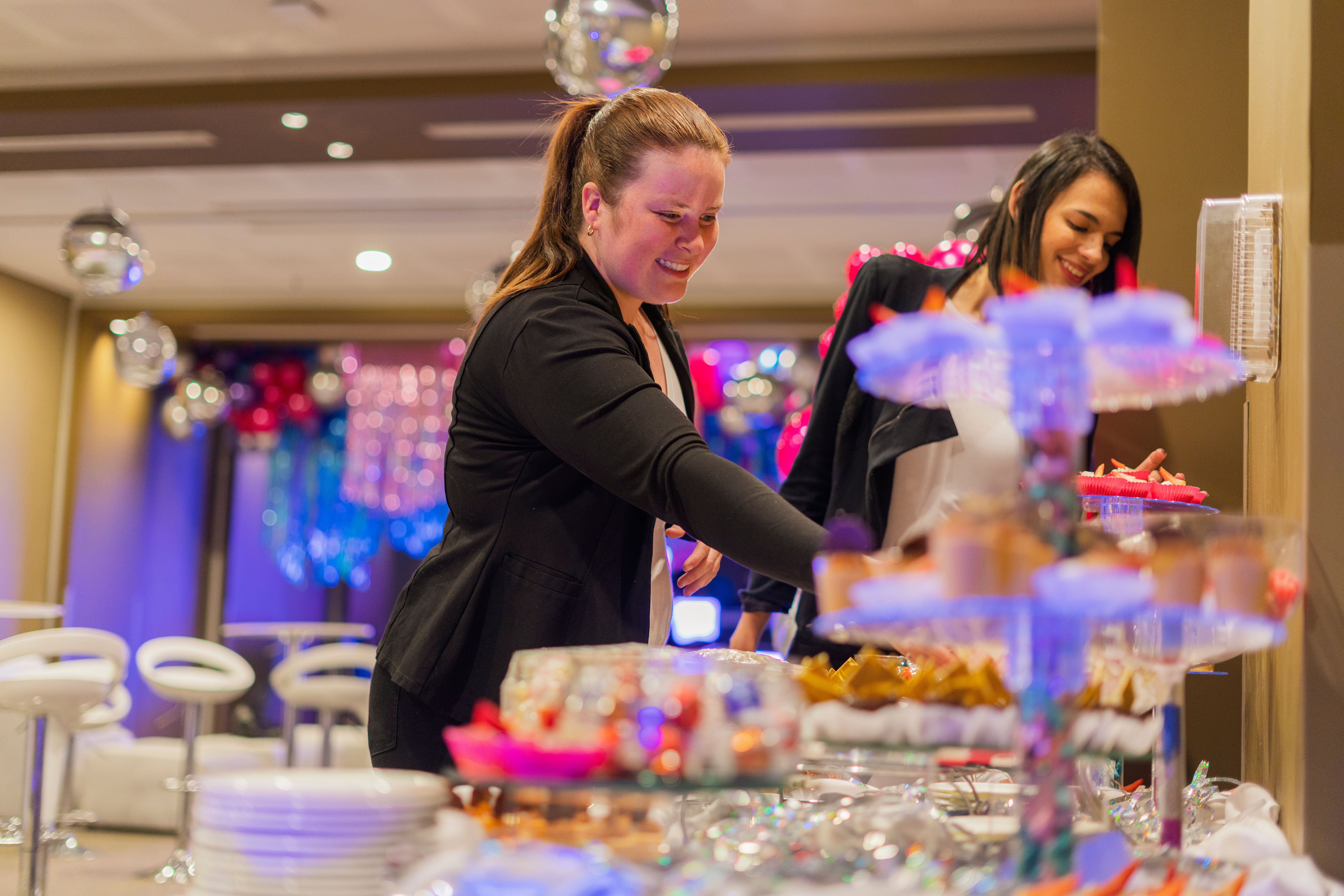 Latin woman event organizer is reviewing the last details of her prepared party Latin woman event organizer is reviewing the last details of her prepared party