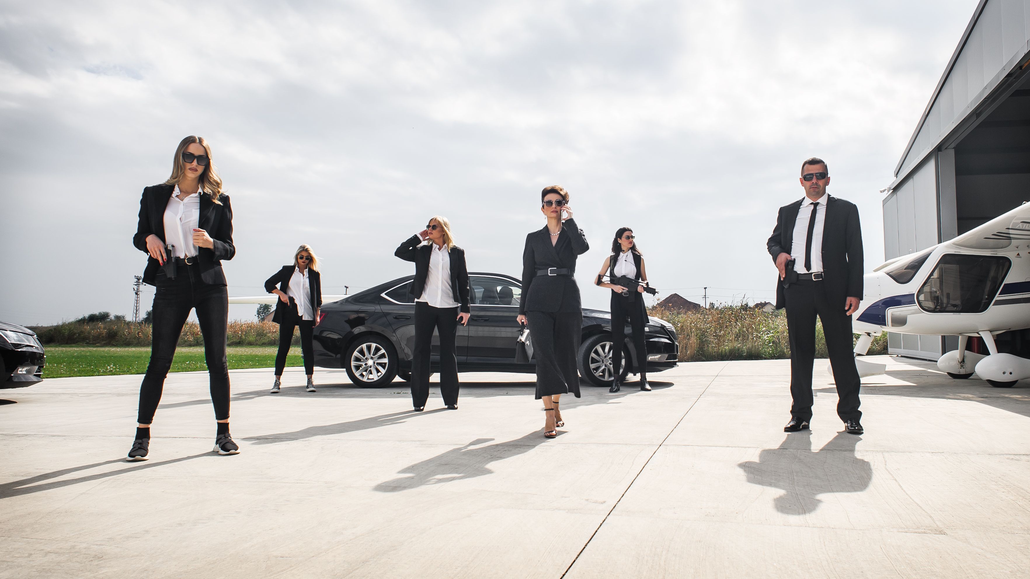 Female male security bodyguards team protect VIP celebrity public person