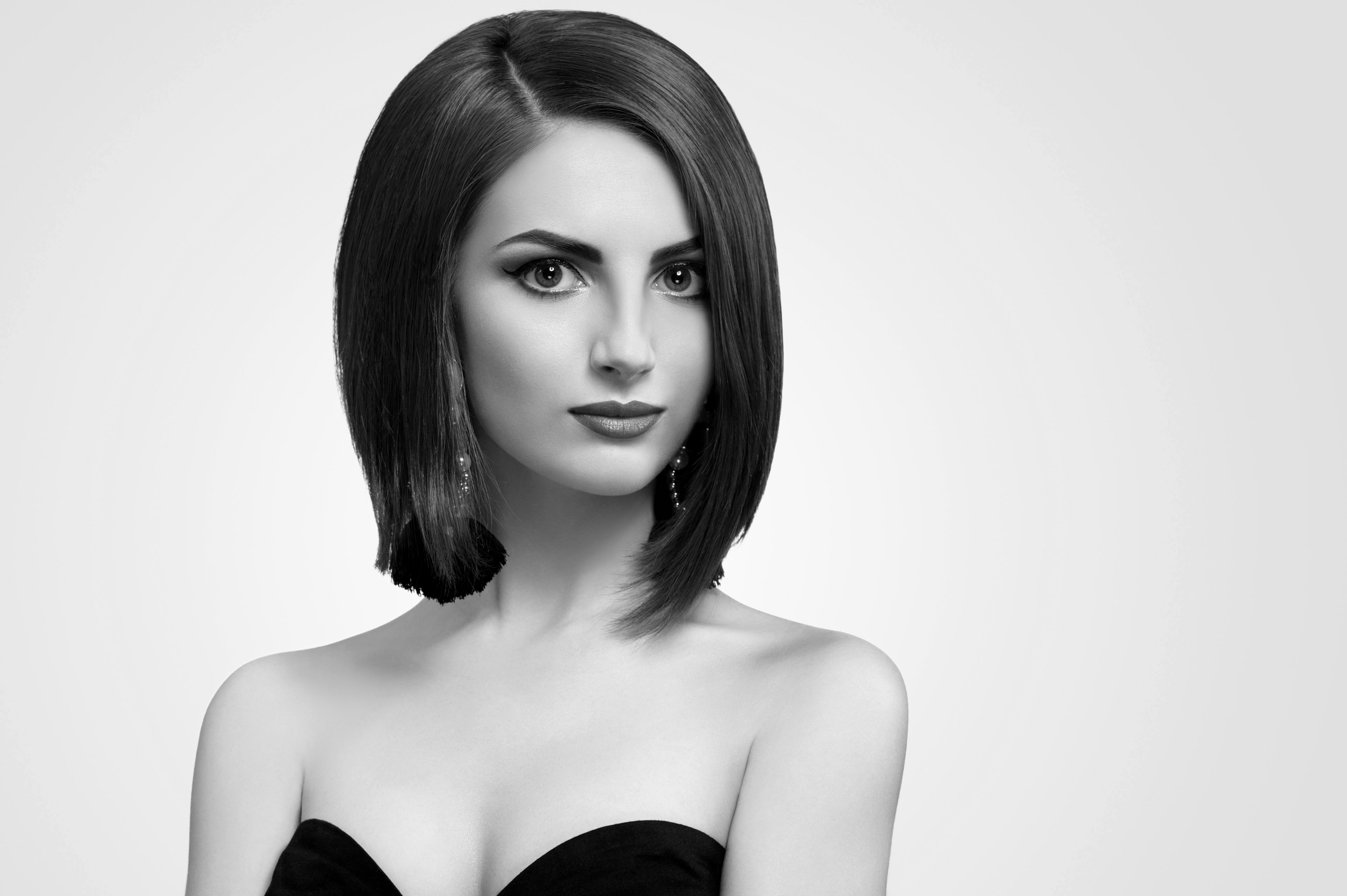 Black and white studio shots of a classy young woman with short