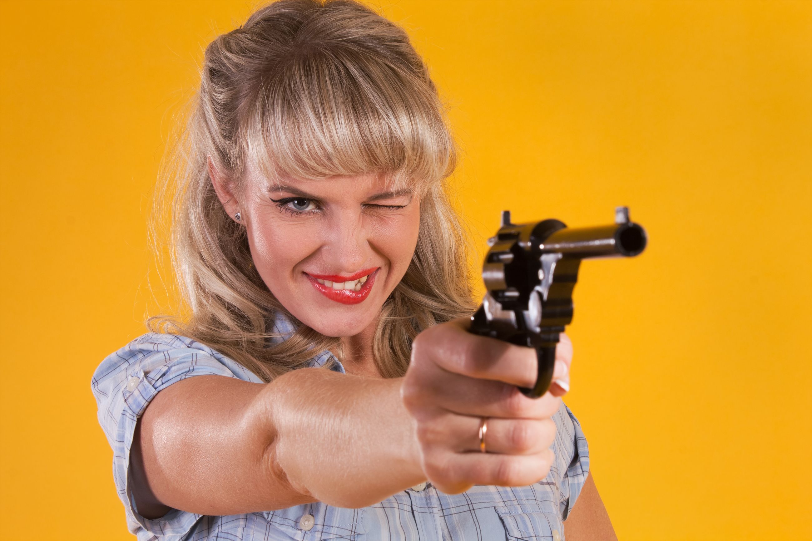 Cowboy woman aim with a pistol