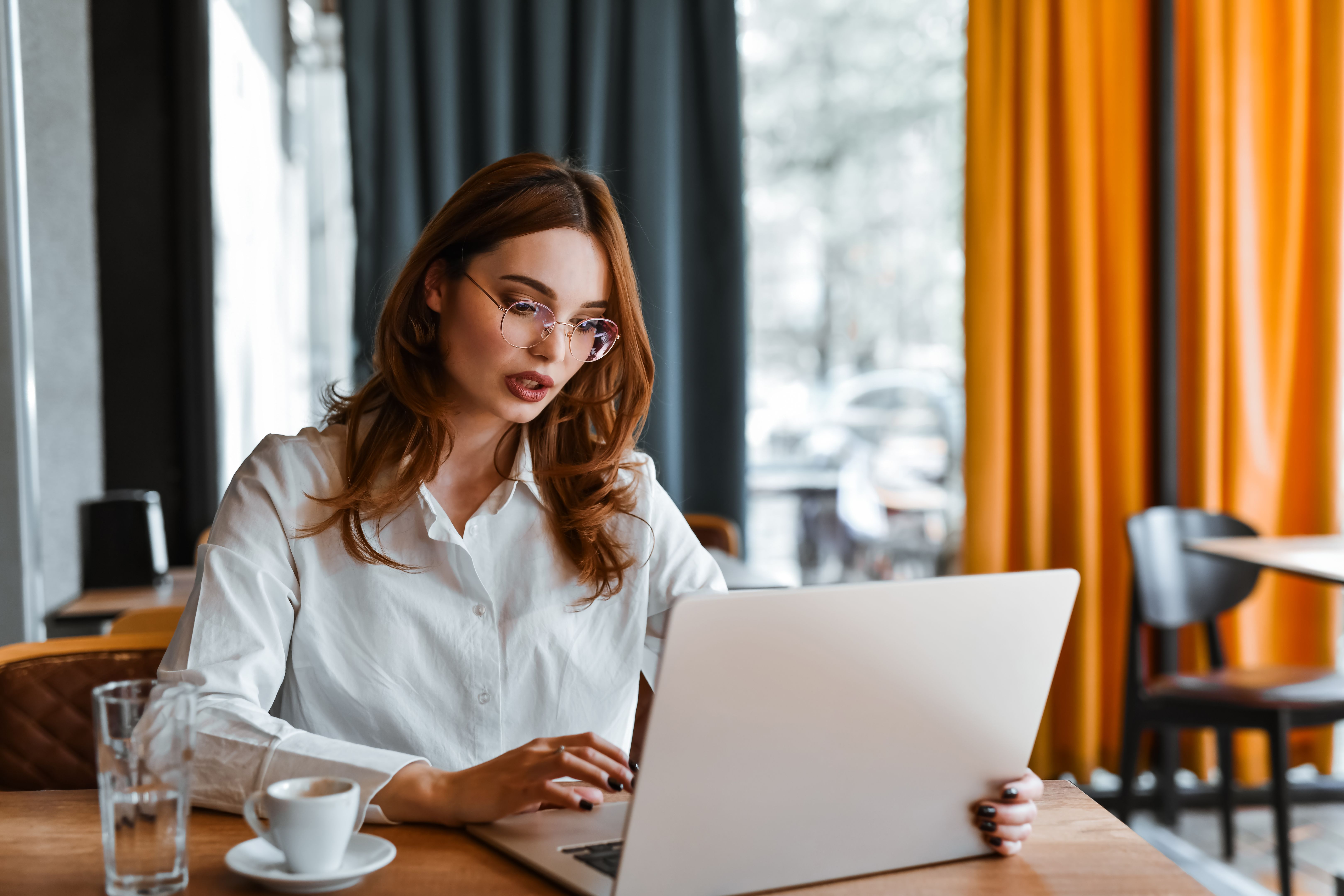 Coffee Time And Laptop Work For Female Freelancer
