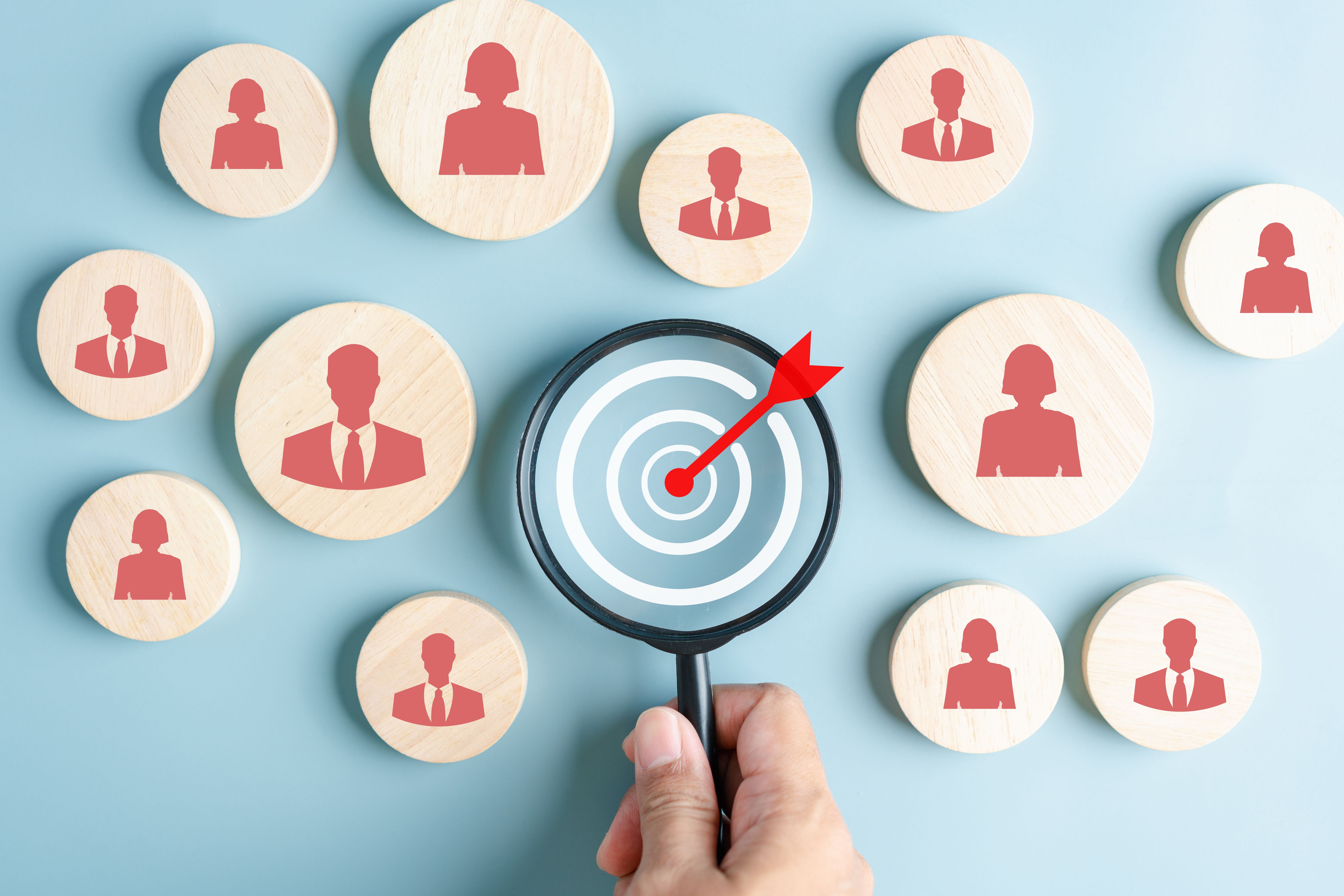 HRM or Human Resource Management, Magnifier glass focus to manager icon which is among staff icons for human development recruitment leadership and customer target group concept.