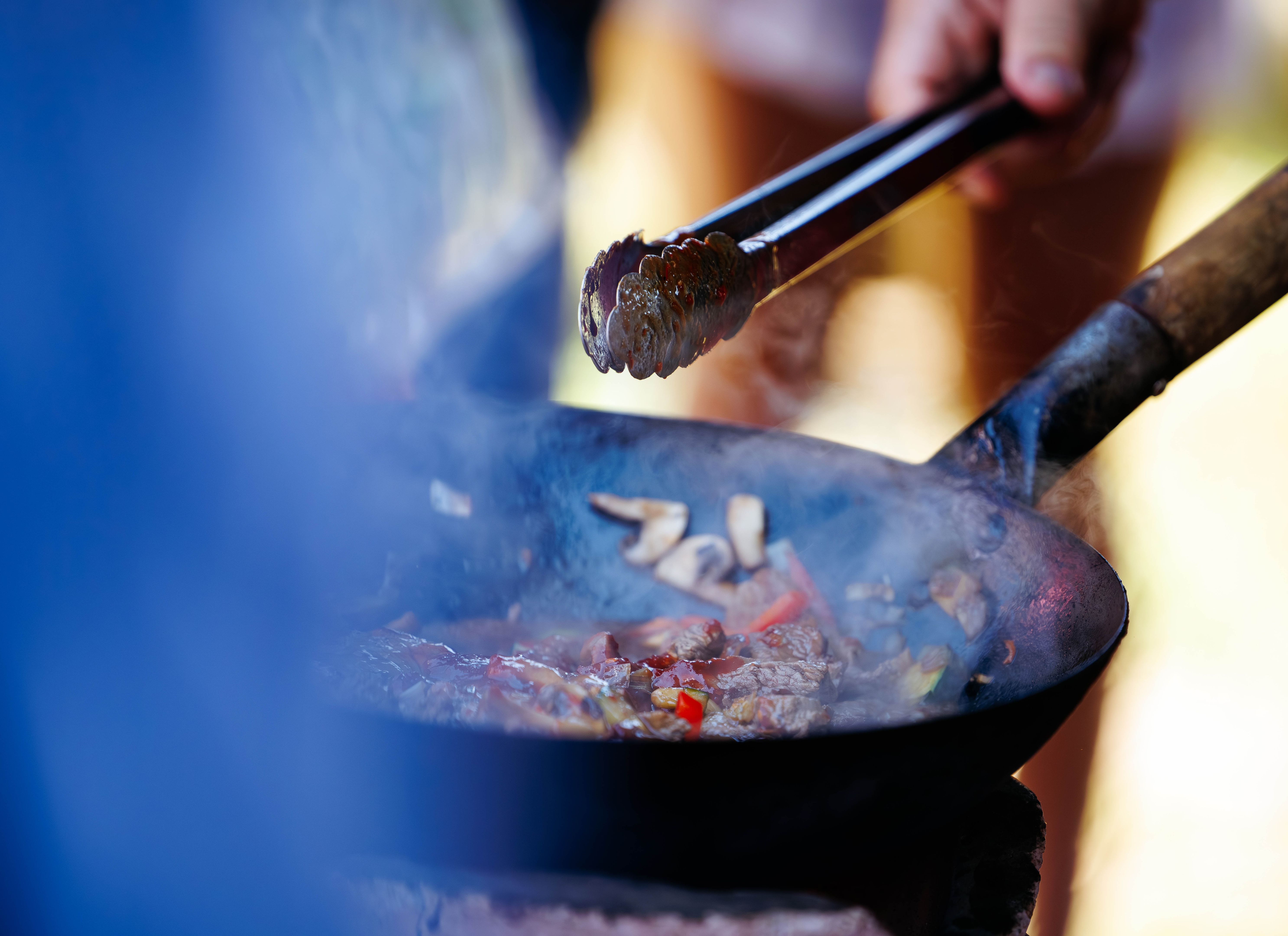 chef cooking mushrooms