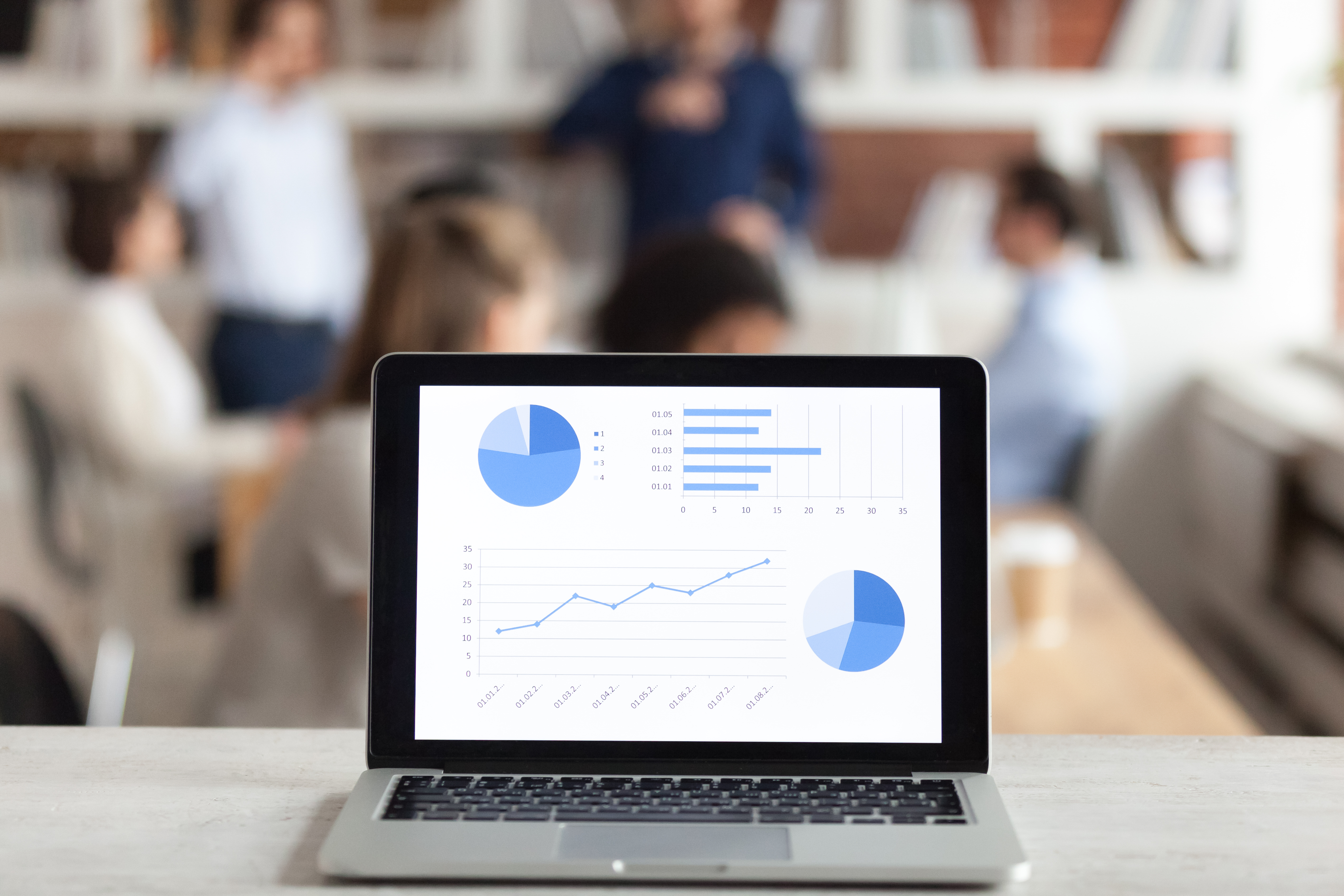 Laptop with financial charts and graph on screen Laptop with financial charts and graph on screen