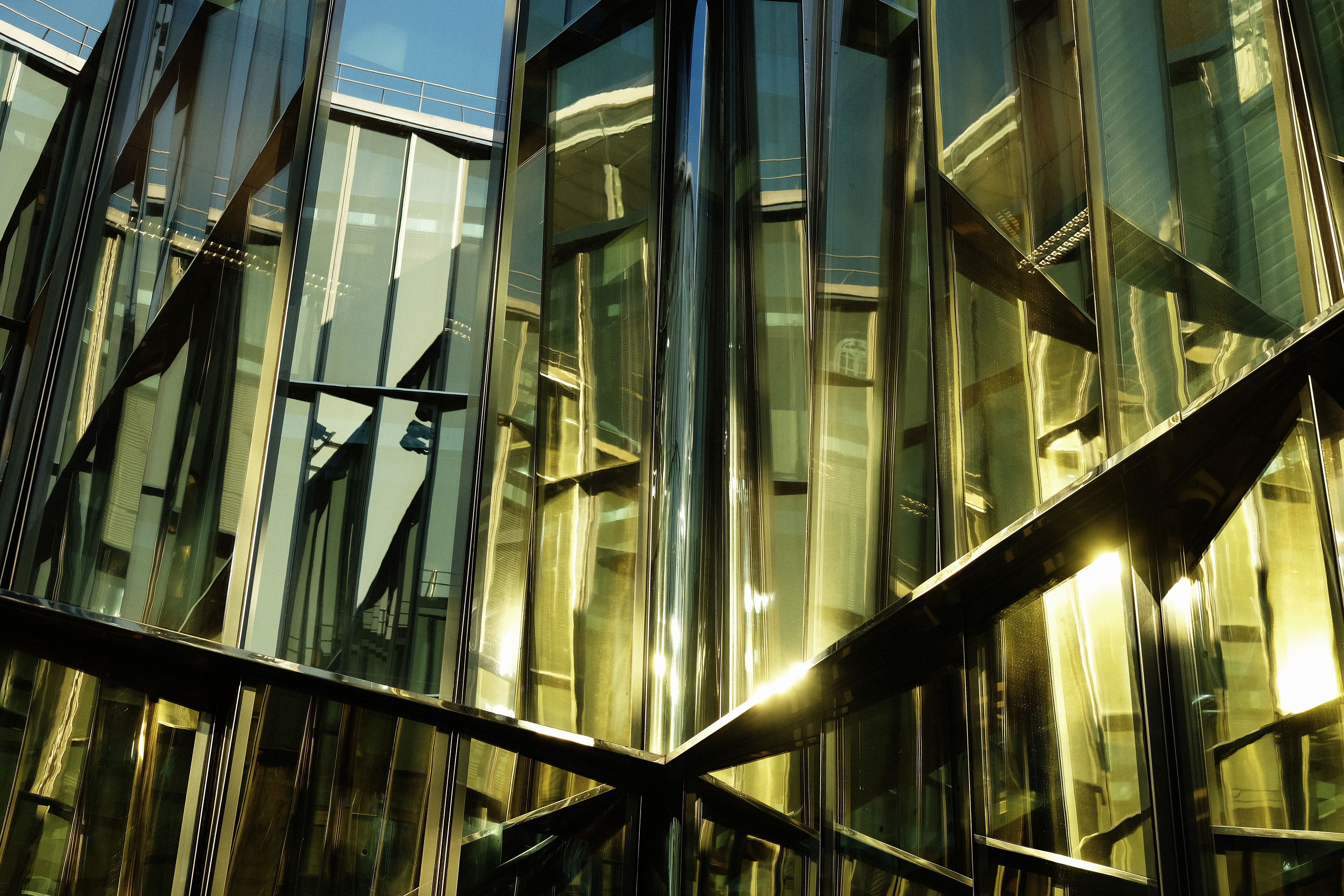 modern business center with big glass wnindows, summer day