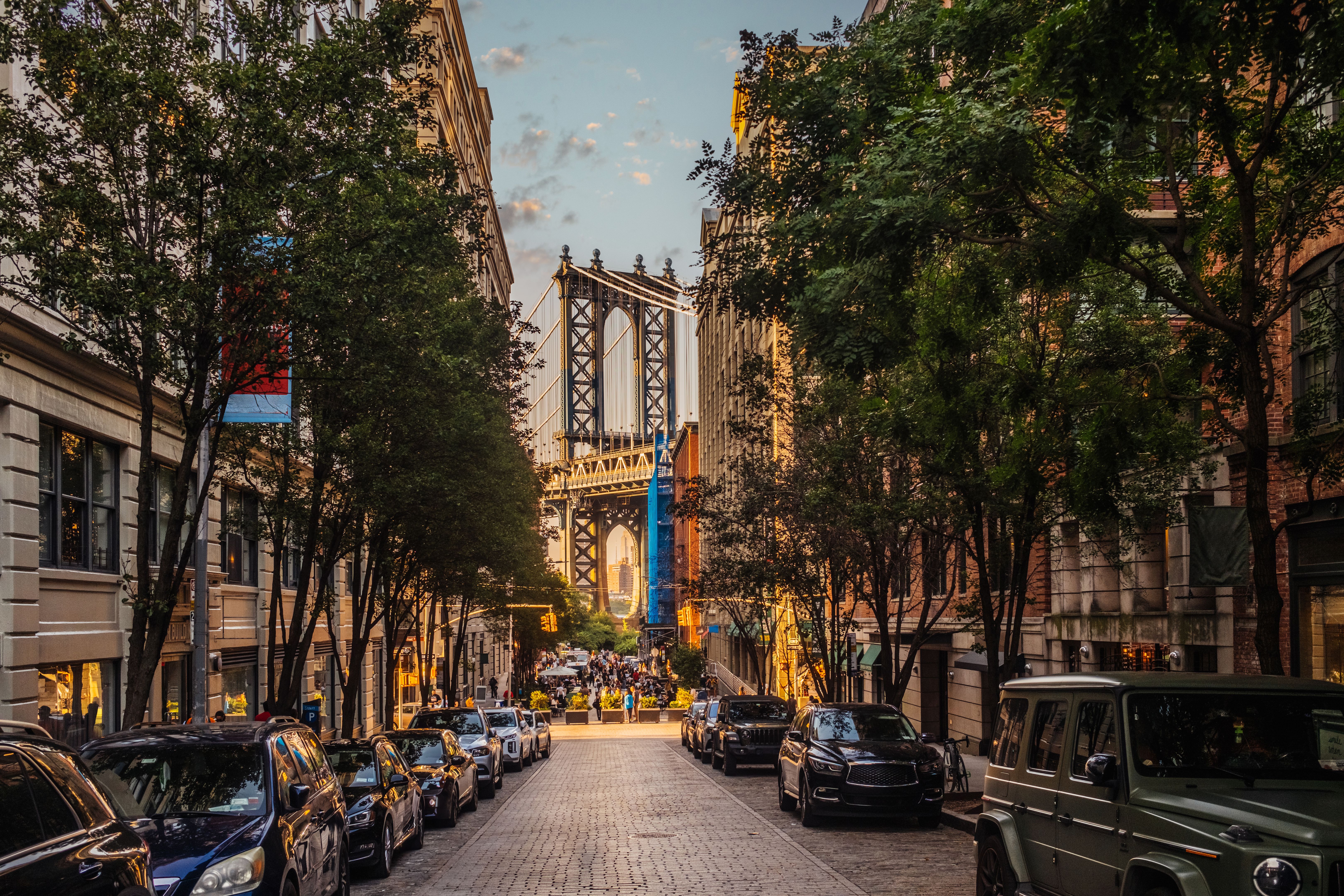 Cobblestone street leading to manhattan bridge at sunset in dumbo, new york city
