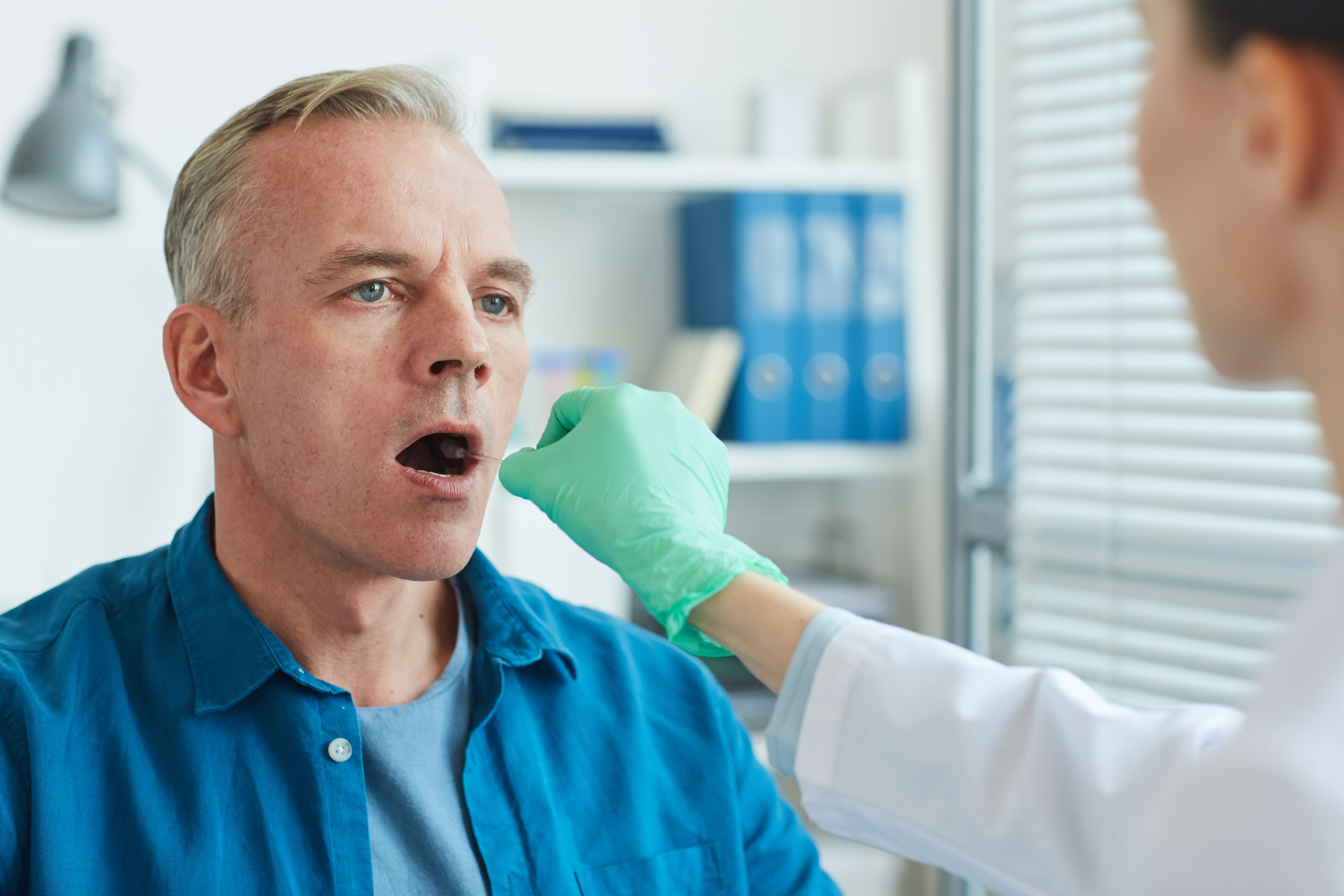 Female Doctor Taking Swab Test
