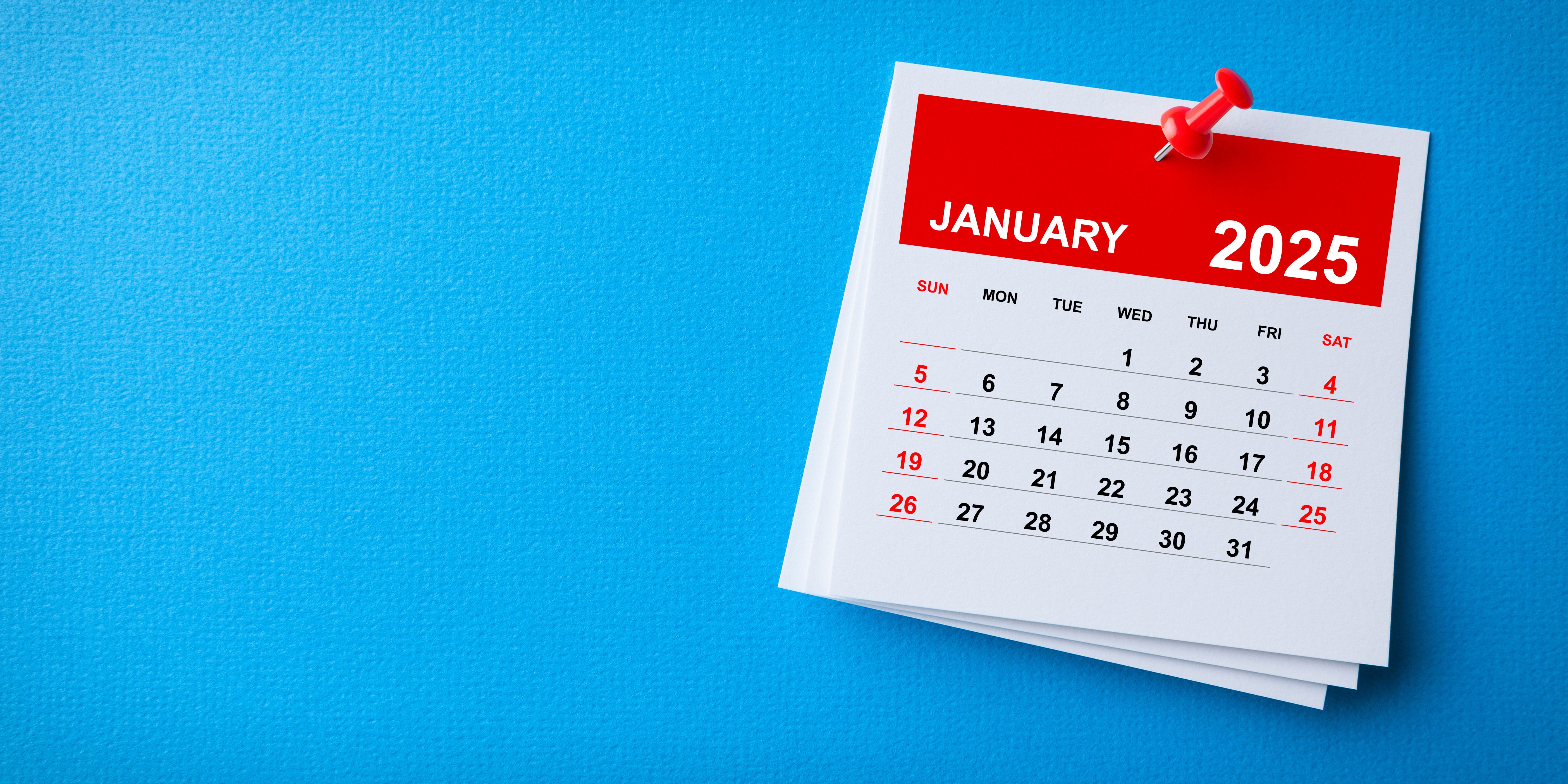 White Sticky Note With 2025 January Calendar And Red Push Pin On Blue Background