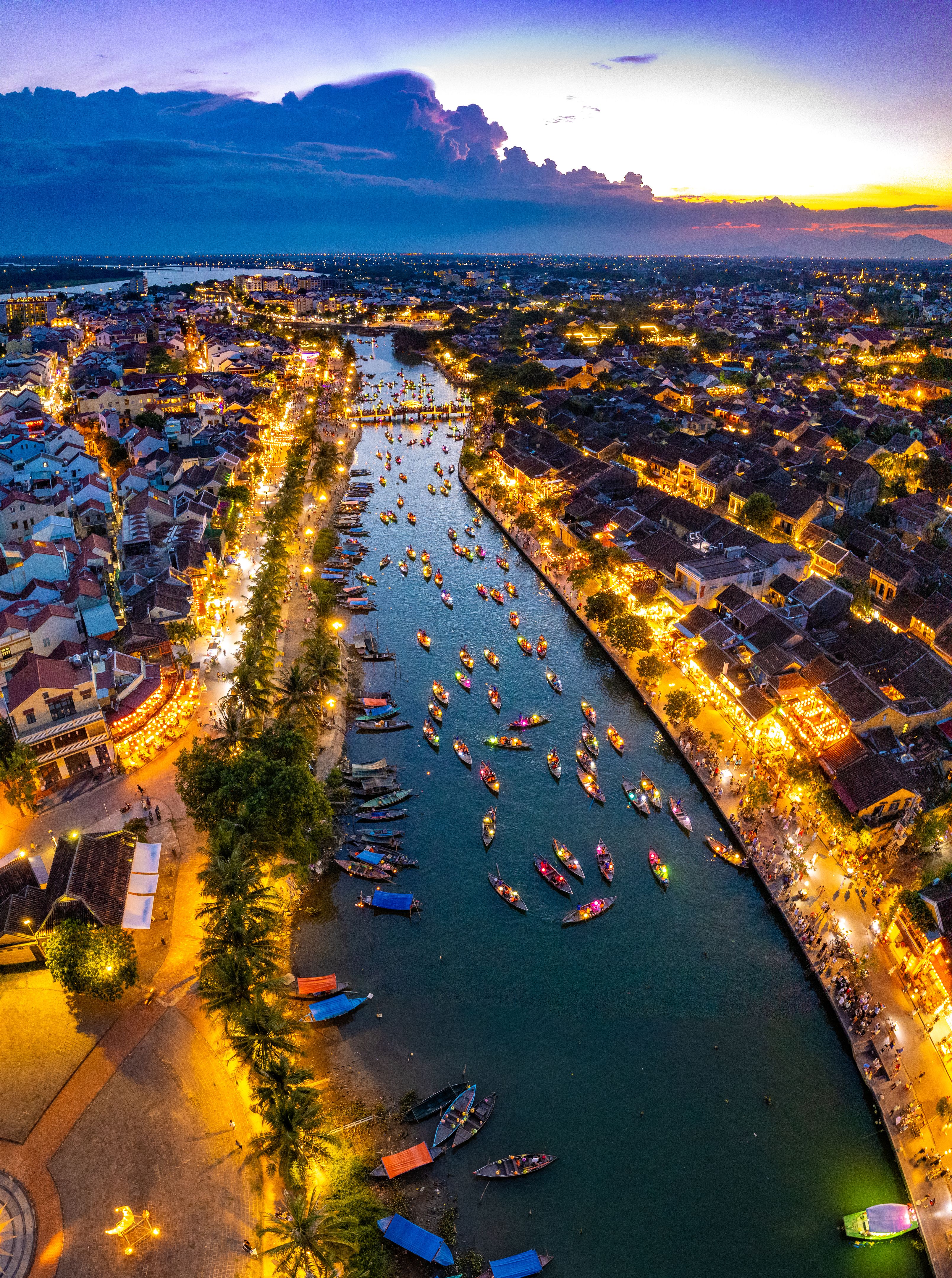 Aerial view of Hoi An Ancient Town with lantern boats on Hoai river, in Hoi An, Vietnam