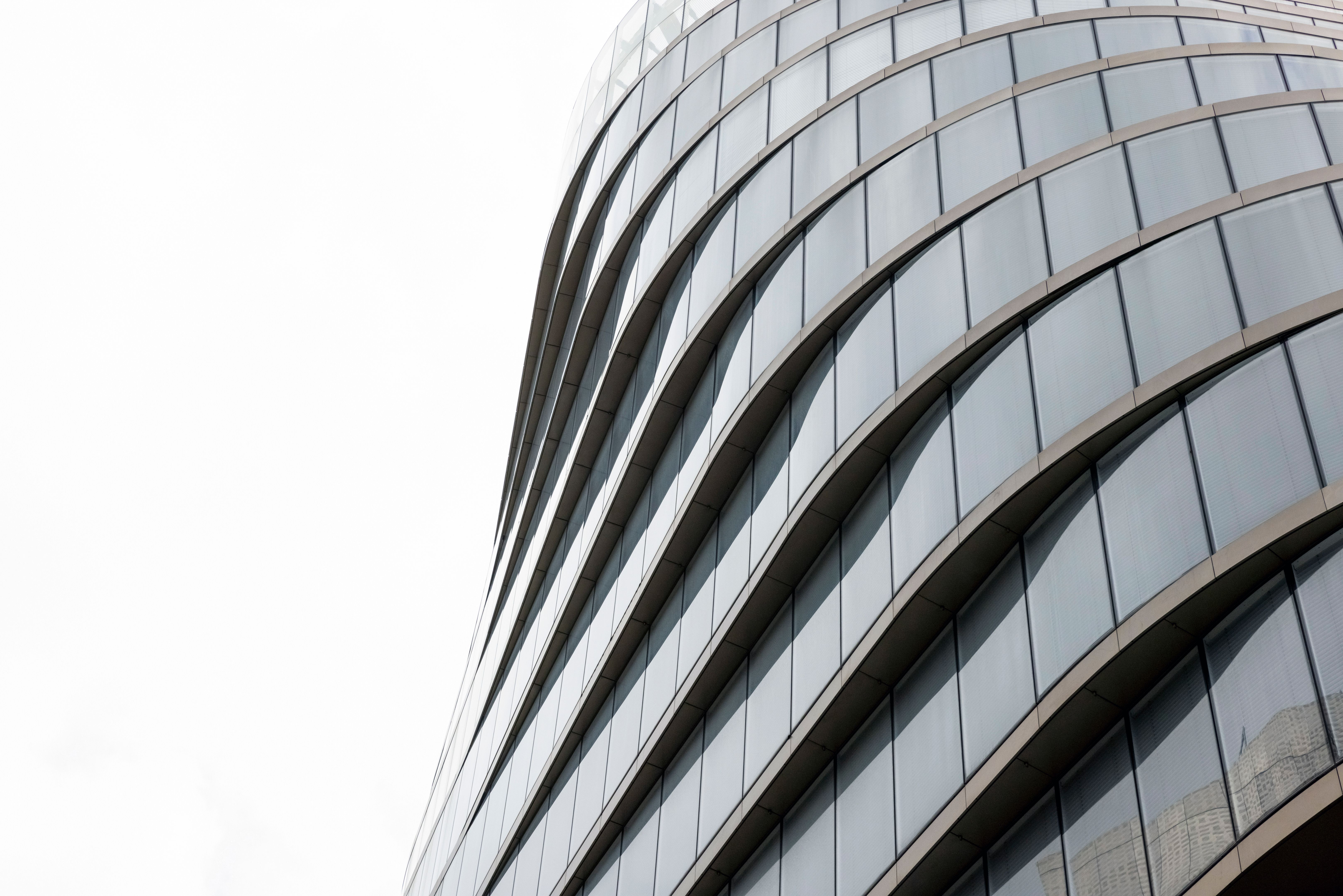 Closeup modern office building, white background with copy space