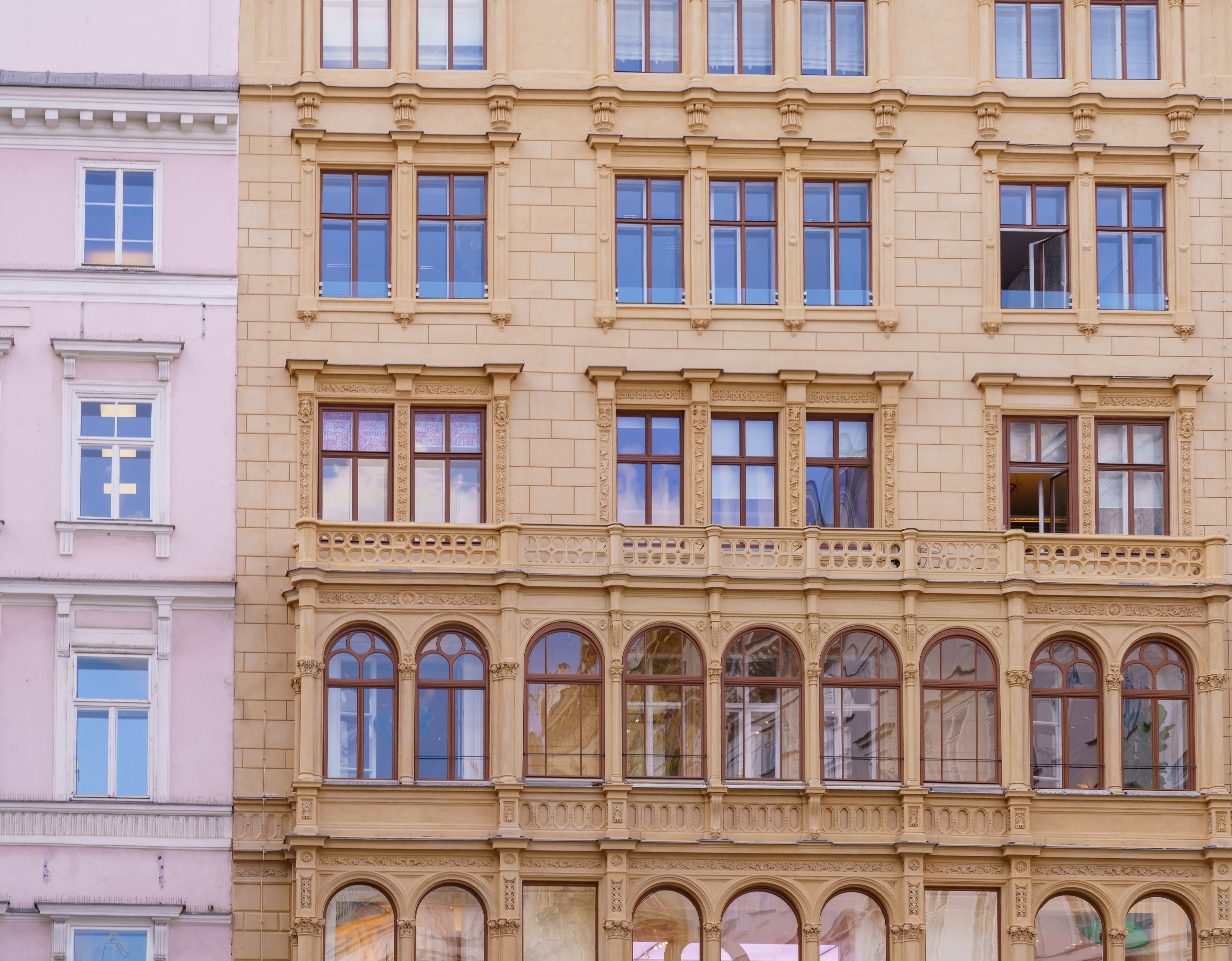 Historic facade of Vienna residential building with decorative windows