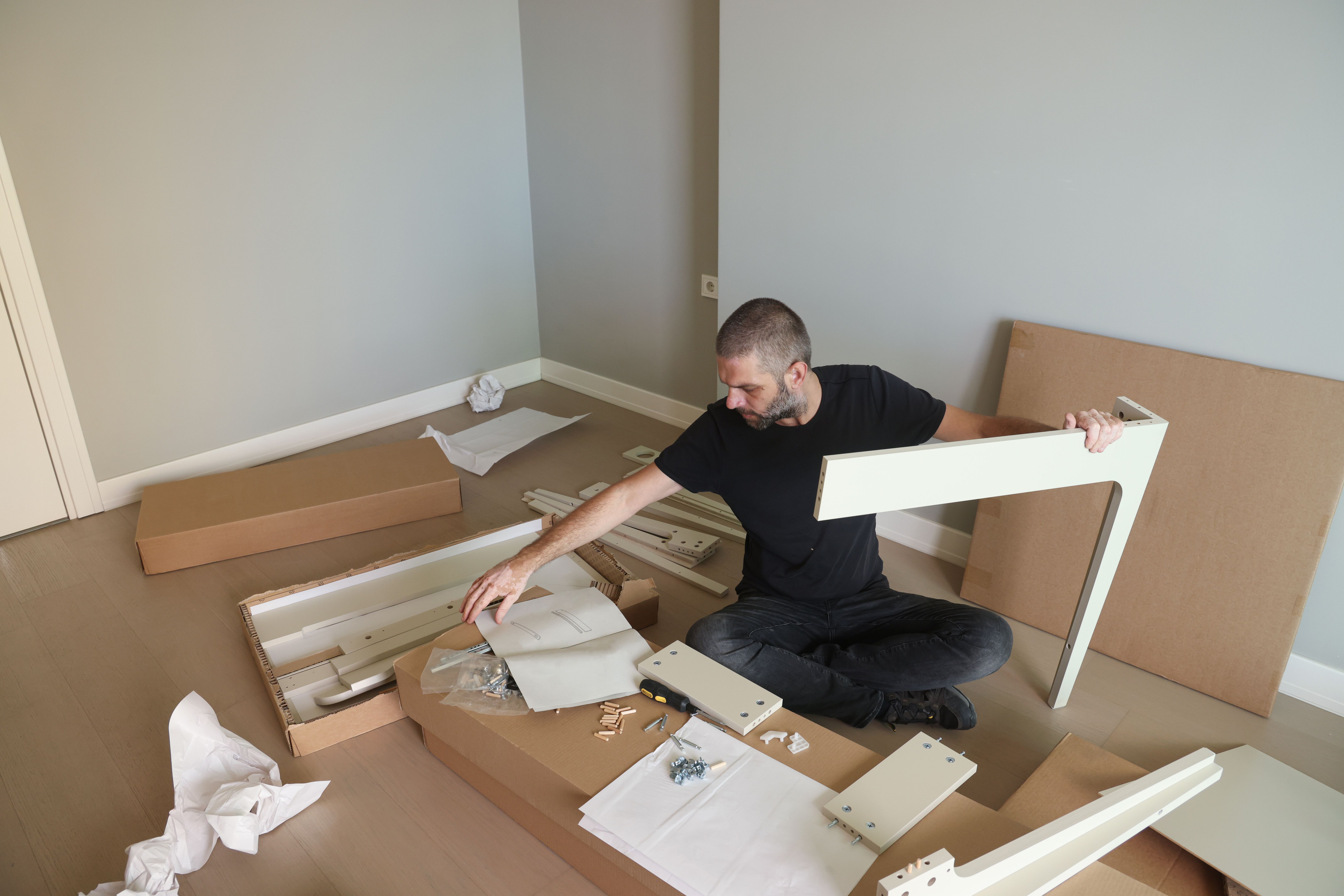 person assembling furniture